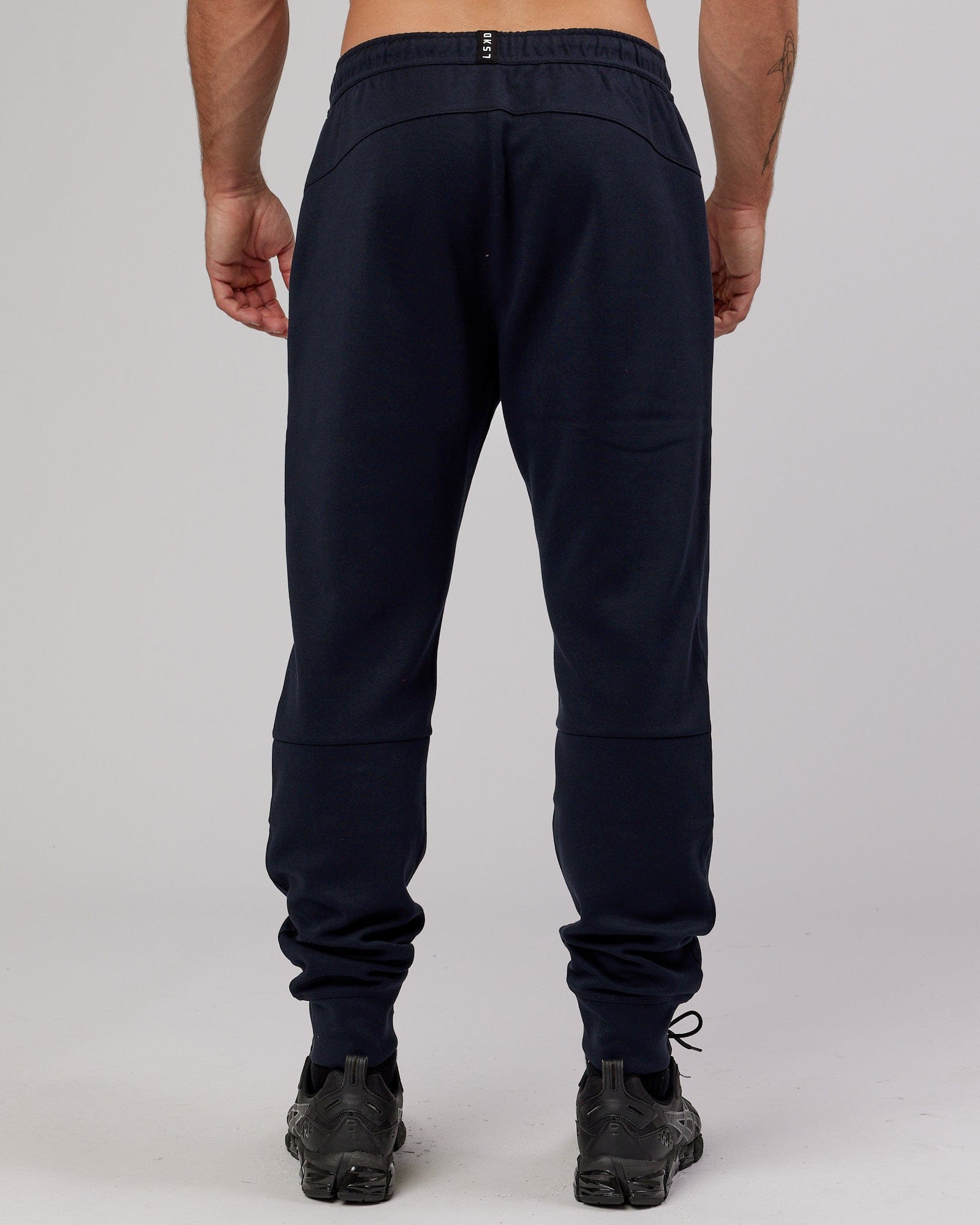 Model wearing Athlete ForgedFleece Zip Trackpant - Dark Navy