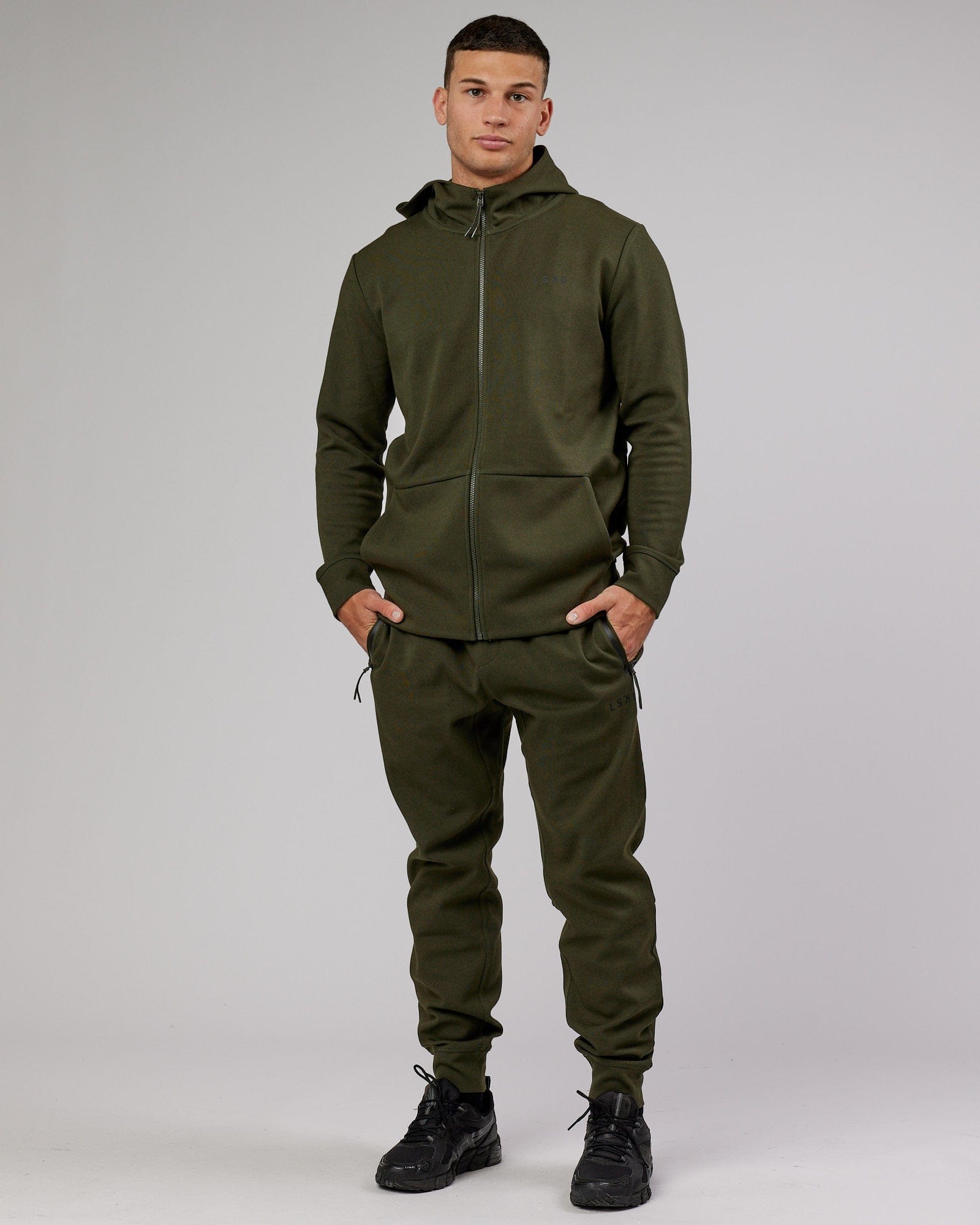 Model wearing Athlete ForgedFleece Zip Trackpant - Forest Night