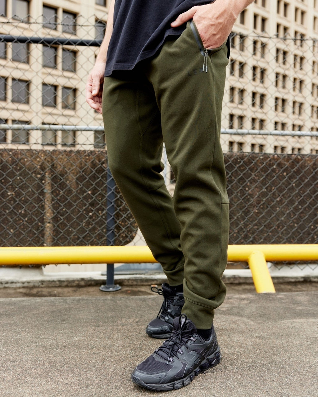Model wearing Athlete ForgedFleece Zip Trackpant - Forest Night