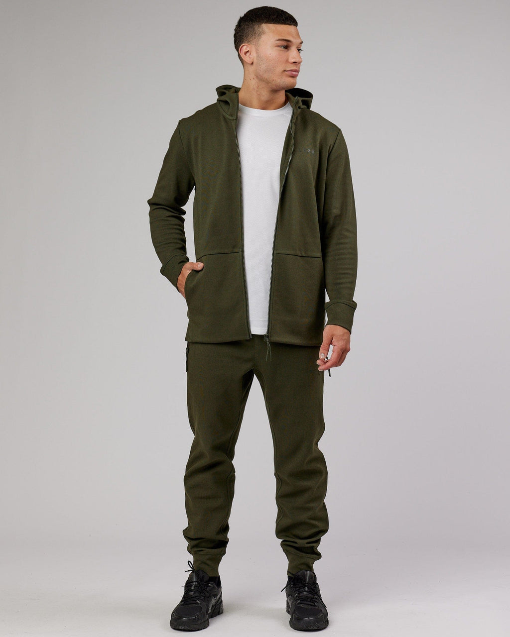 Model wearing Athlete ForgedFleece Zip Trackpant - Forest Night