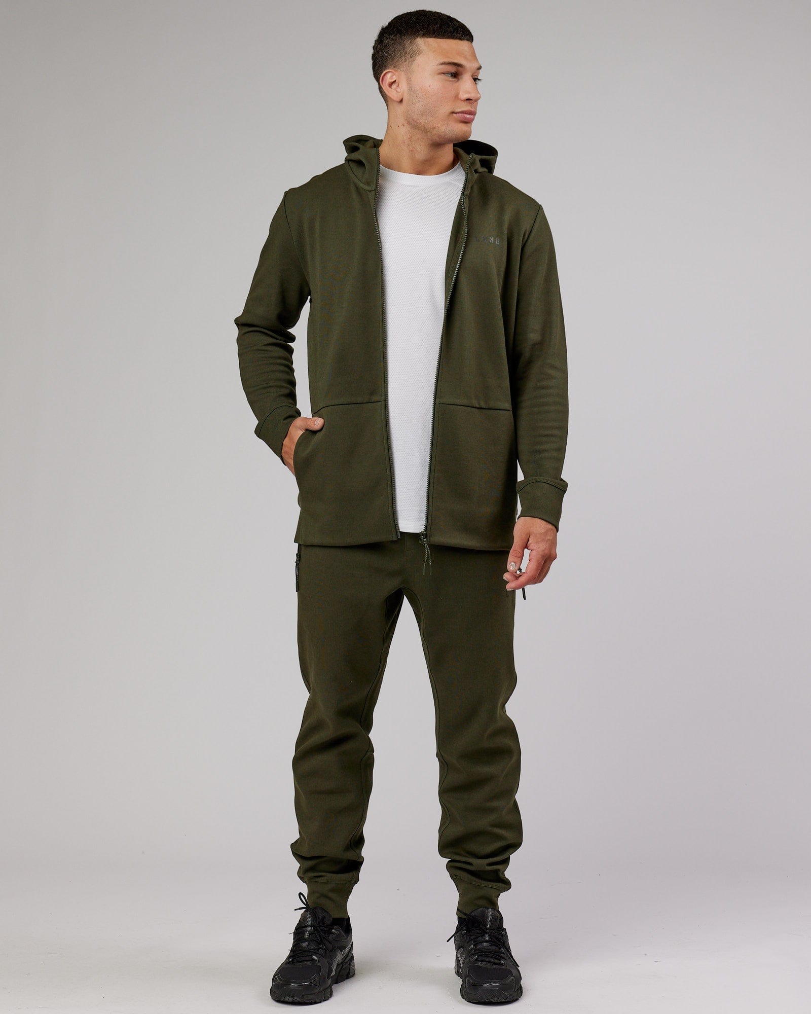 Model wearing Athlete ForgedFleece Zip Trackpant - Forest Night