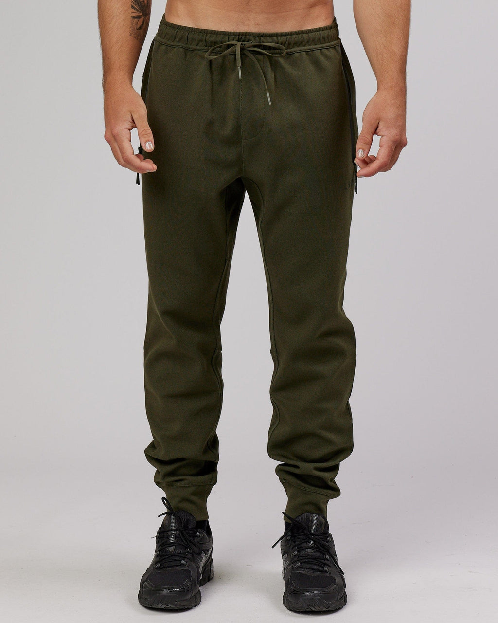 Model wearing Athlete ForgedFleece Zip Trackpant - Forest Night