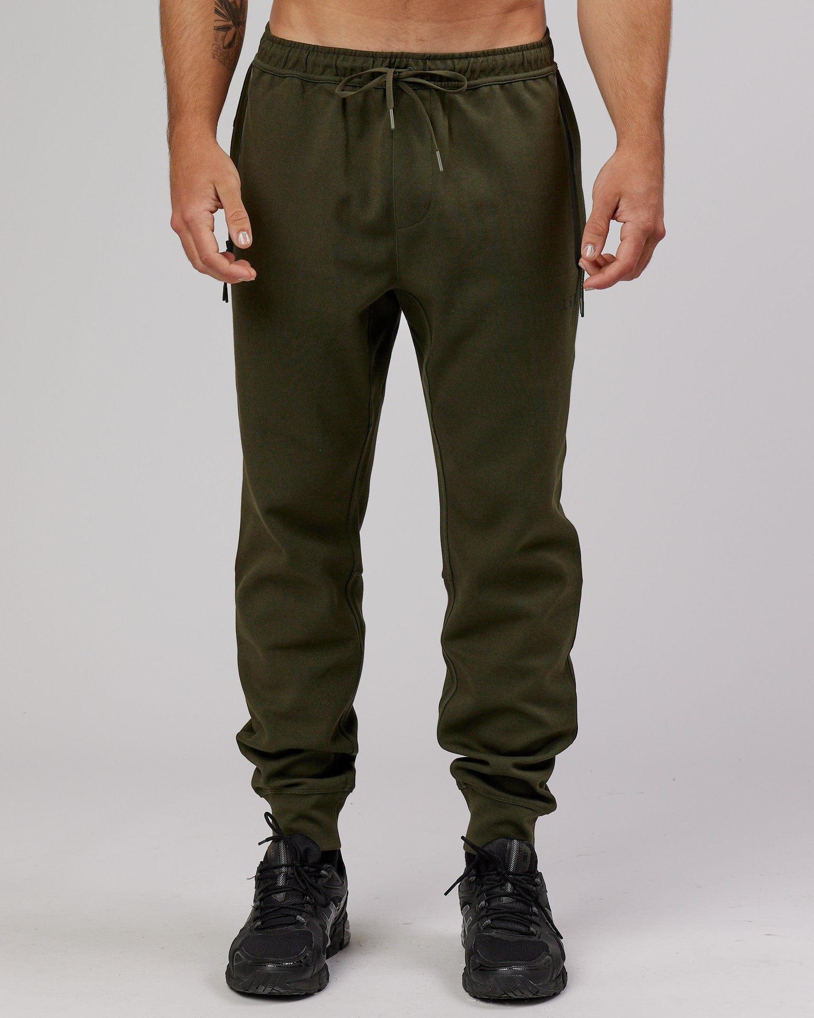 Model wearing Athlete ForgedFleece Zip Trackpant - Forest Night