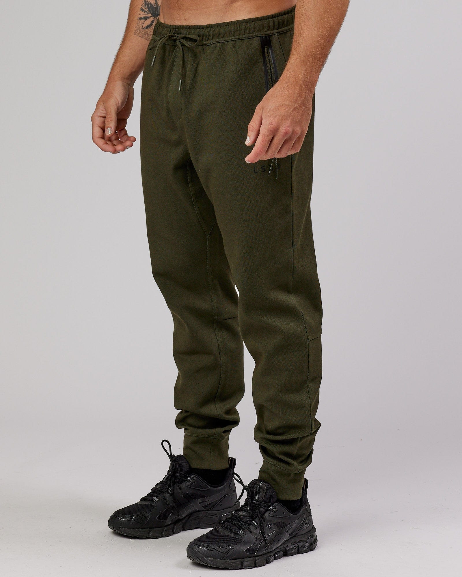 Model wearing Athlete ForgedFleece Zip Trackpant - Forest Night