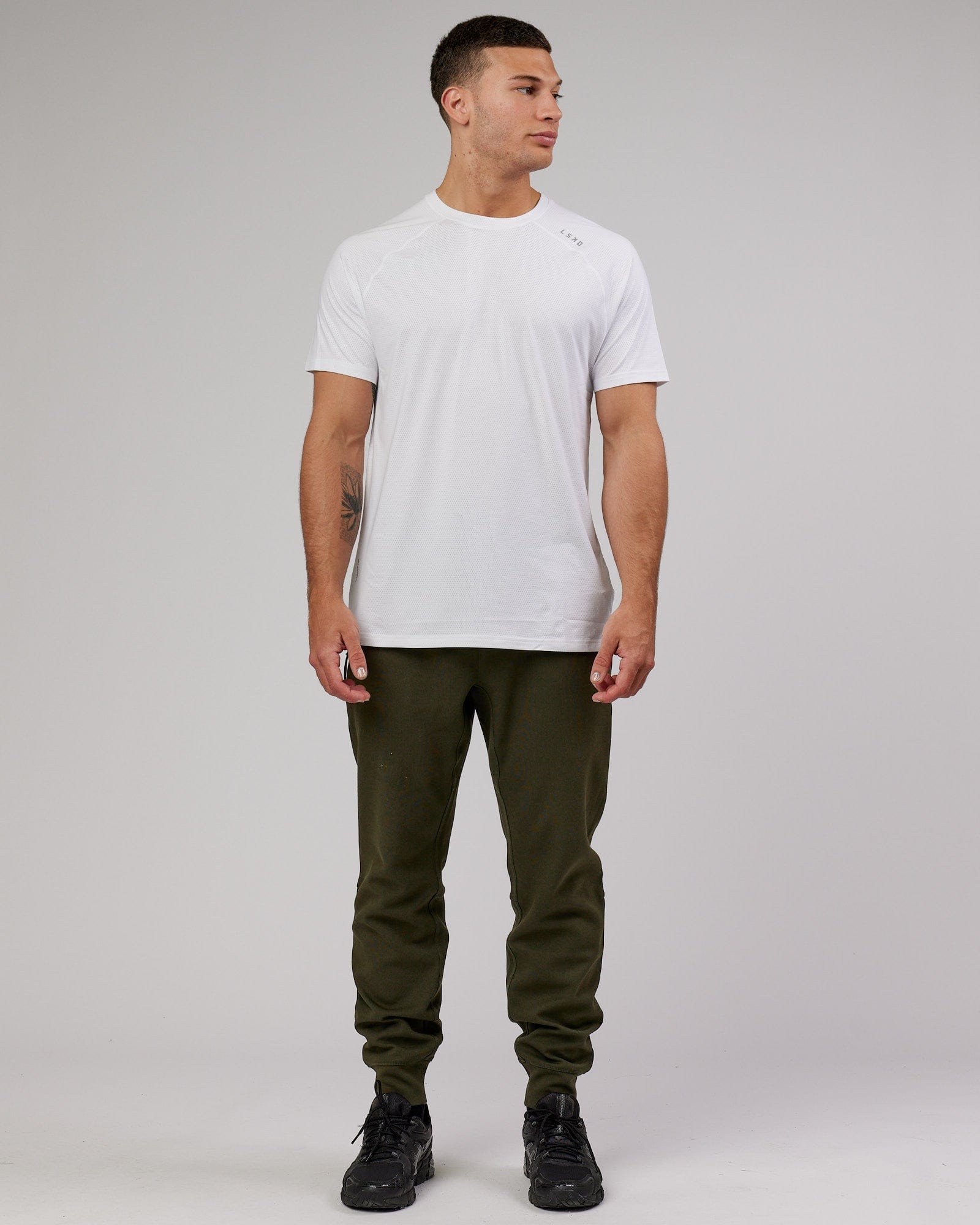 Model wearing Athlete ForgedFleece Zip Trackpant - Forest Night