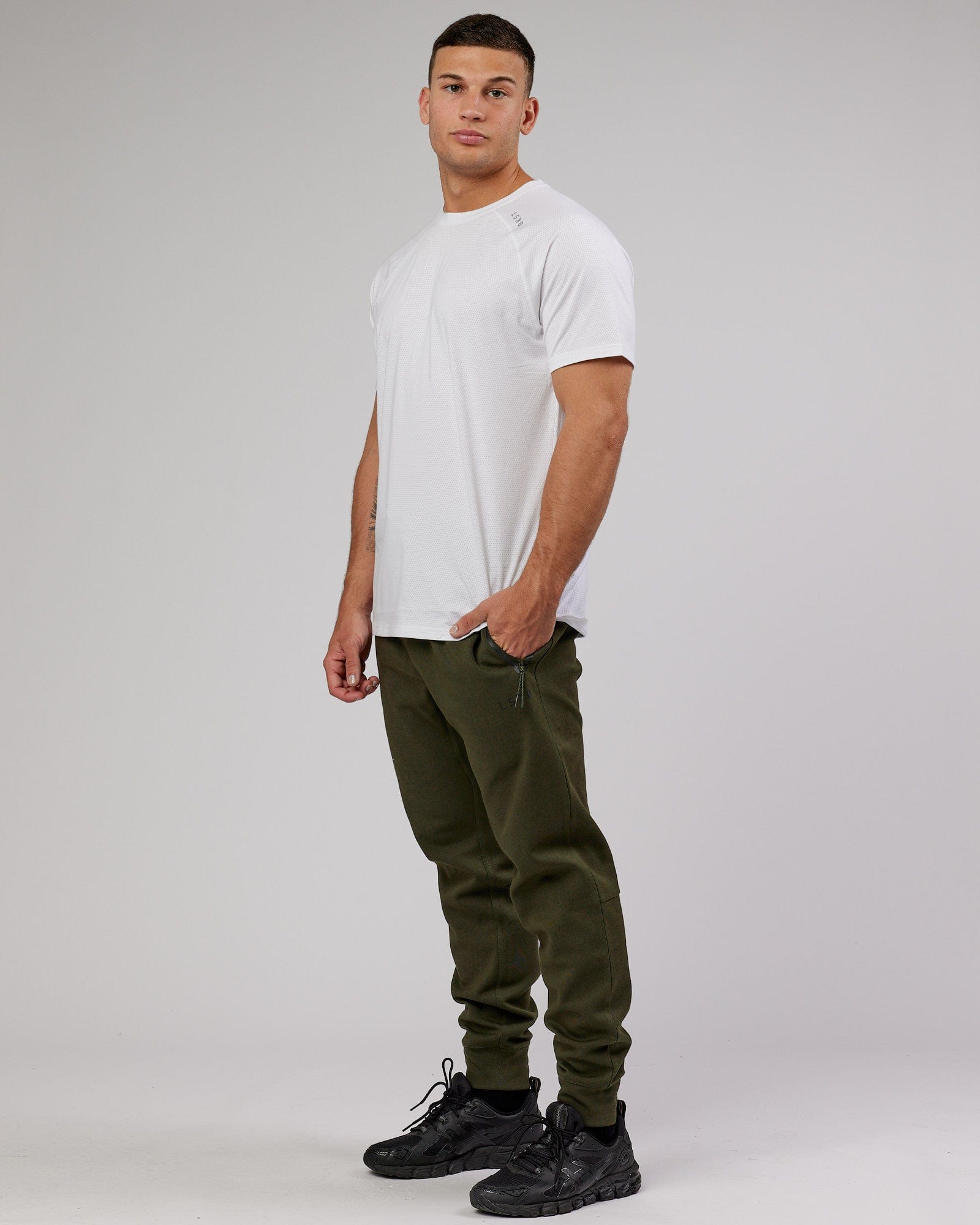 Model wearing Athlete ForgedFleece Zip Trackpant - Forest Night