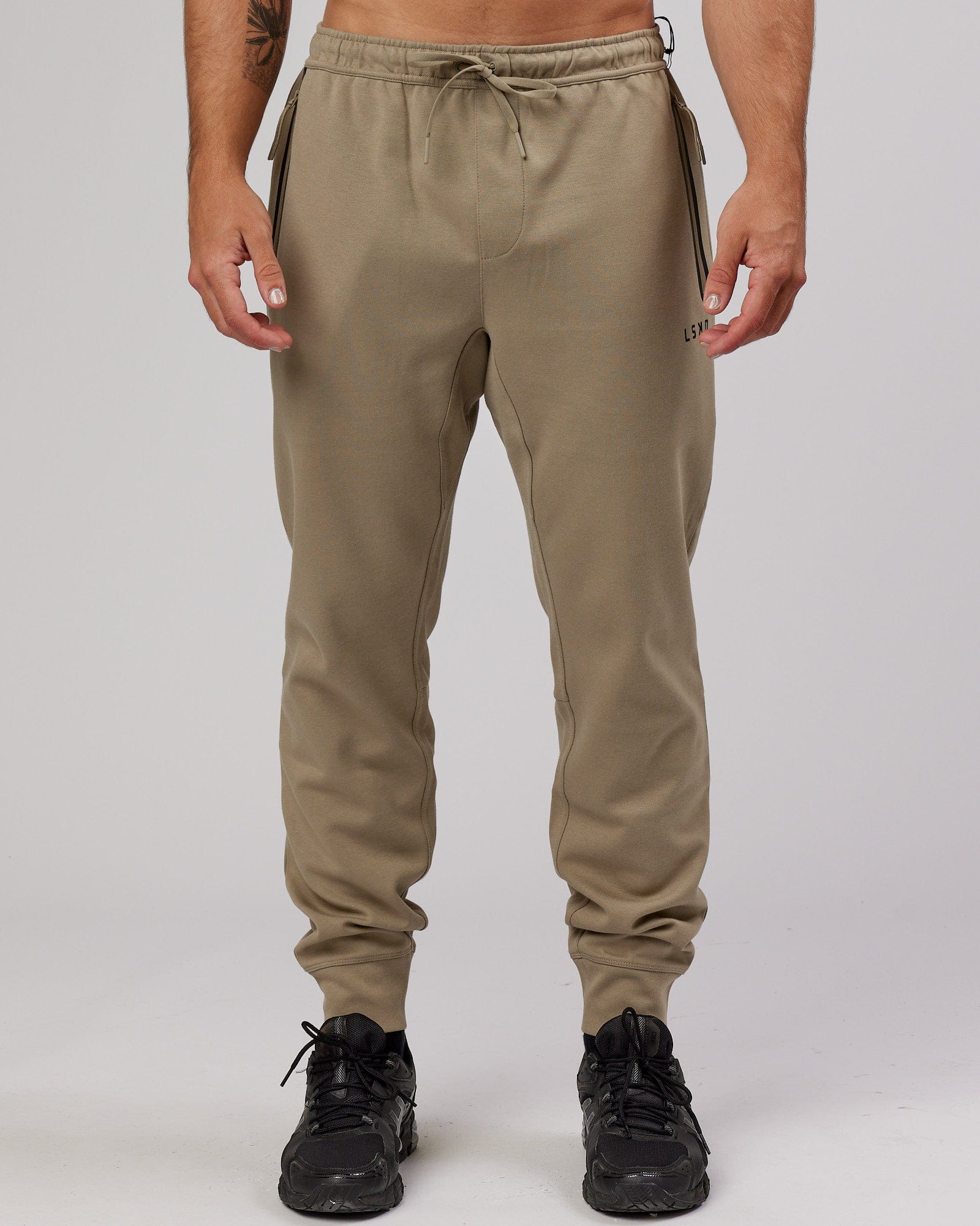 Model wearing Athlete ForgedFleece Zip Trackpant - Laurel Oak