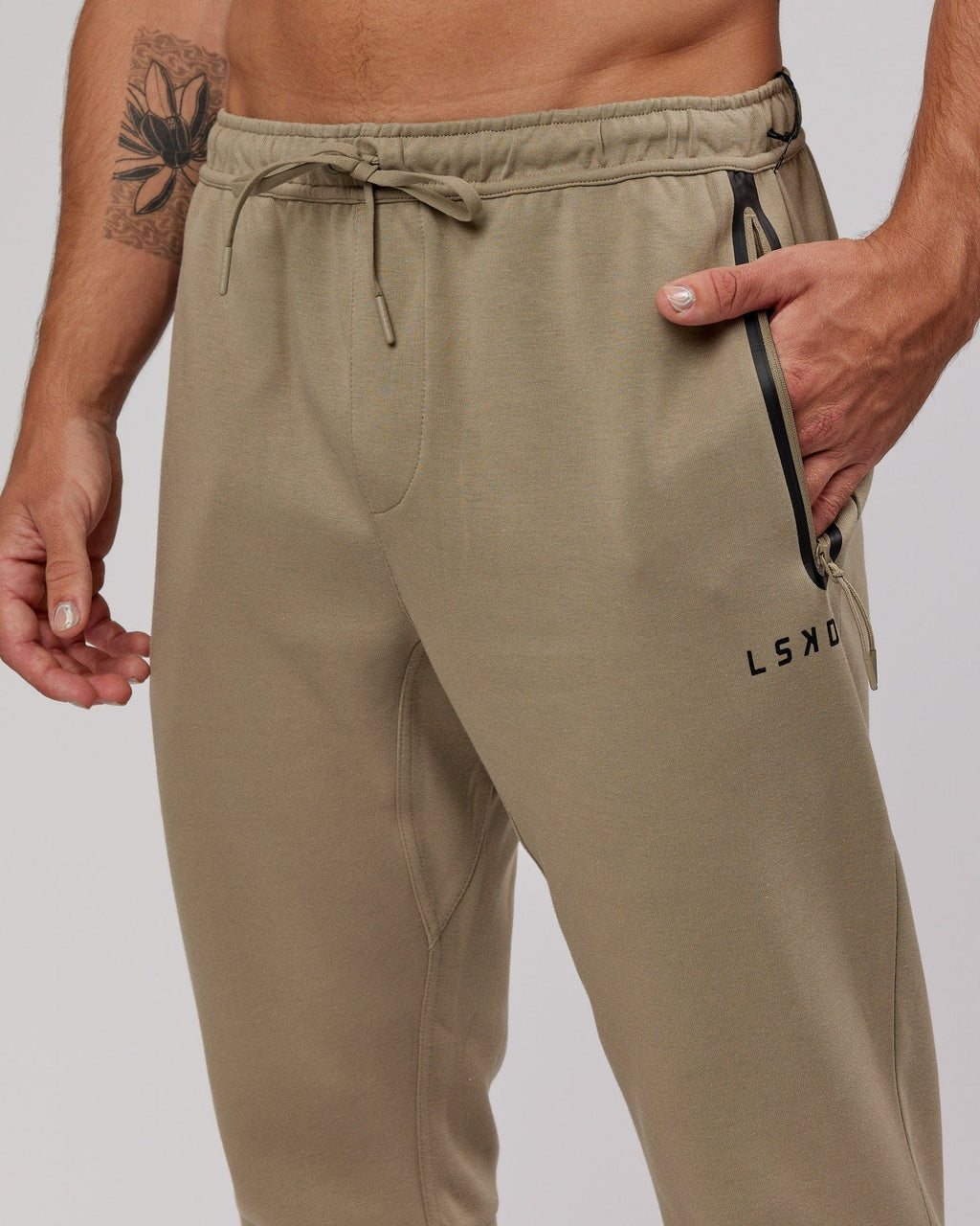 Model wearing Athlete ForgedFleece Zip Trackpant - Laurel Oak