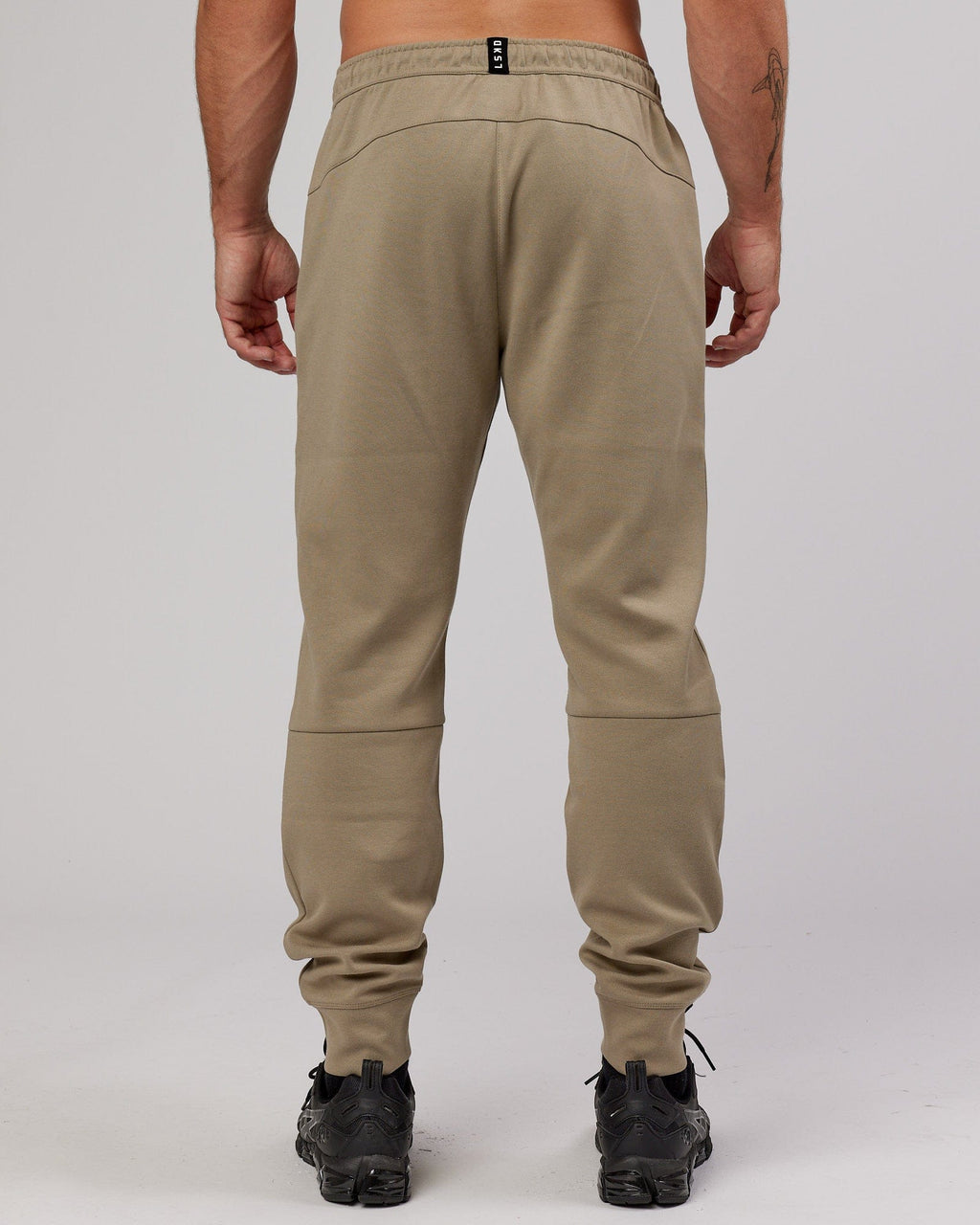 Model wearing Athlete ForgedFleece Zip Trackpant - Laurel Oak