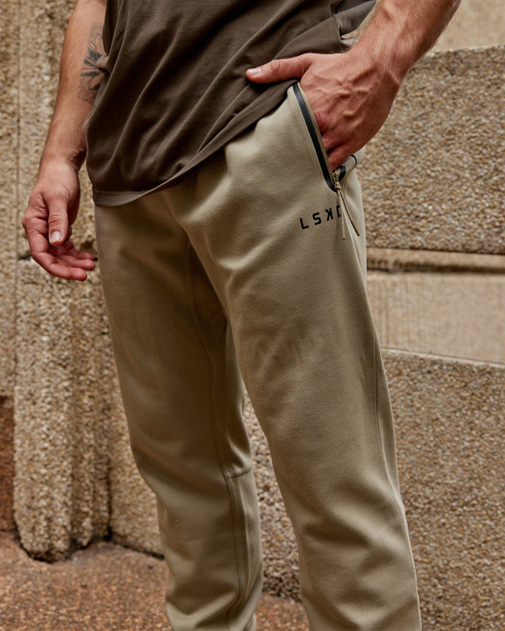 Model wearing Athlete ForgedFleece Zip Trackpant - Laurel Oak