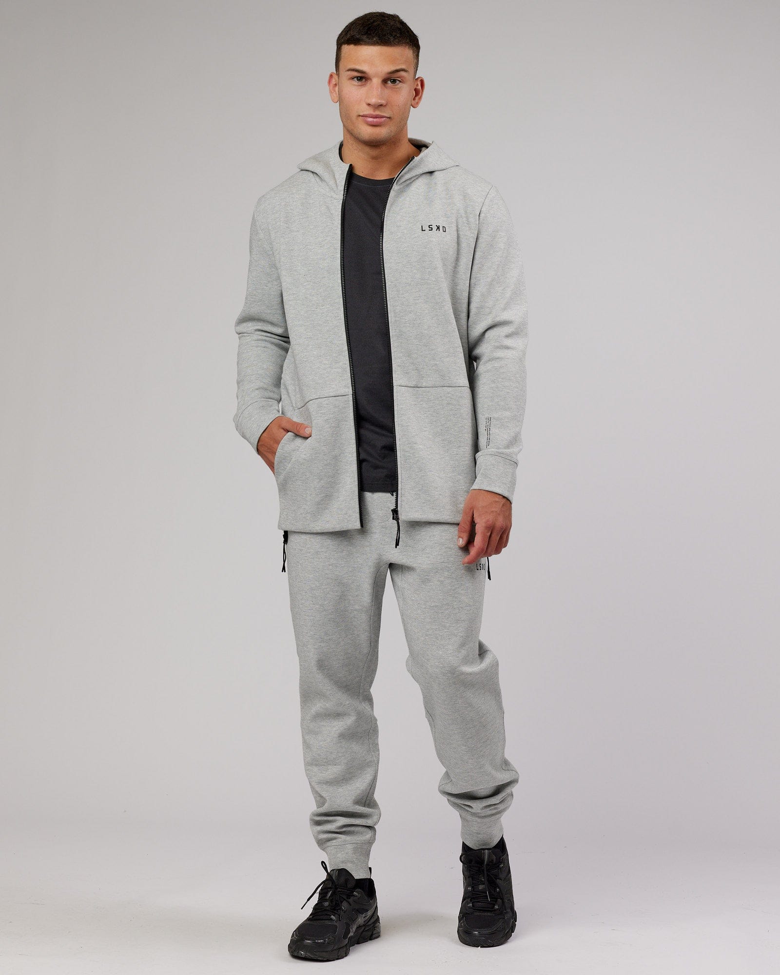 Model wearing Athlete ForgedFleece Zip Trackpant - Lt Grey Marl