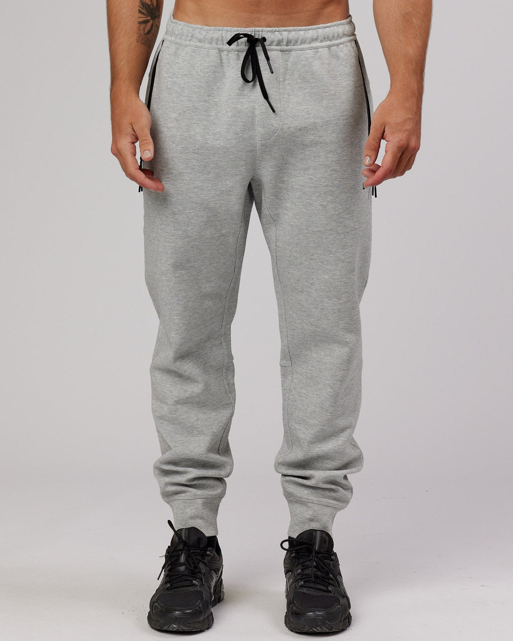 Model wearing Athlete ForgedFleece Zip Trackpant - Lt Grey Marl