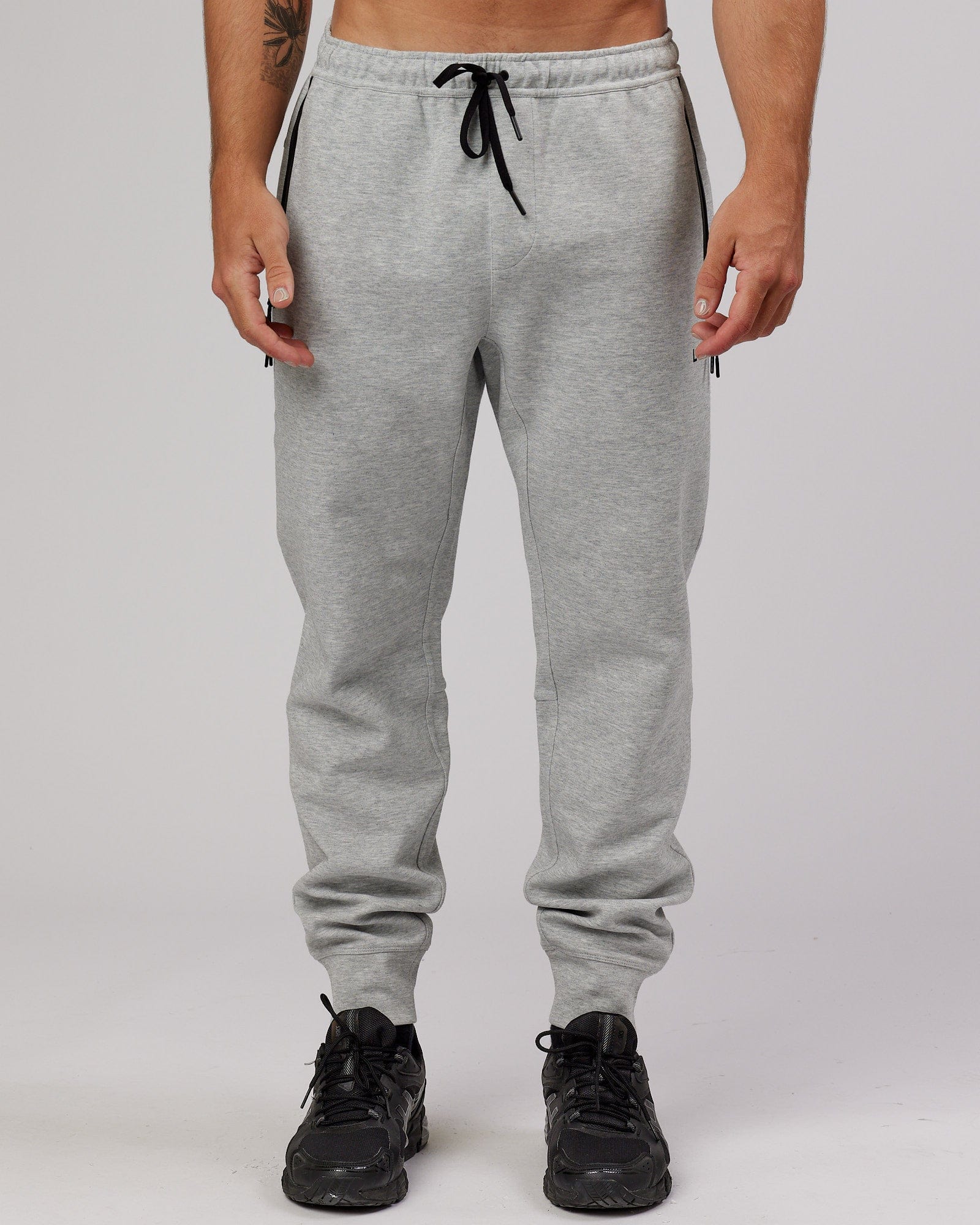 Model wearing Athlete ForgedFleece Zip Trackpant - Lt Grey Marl