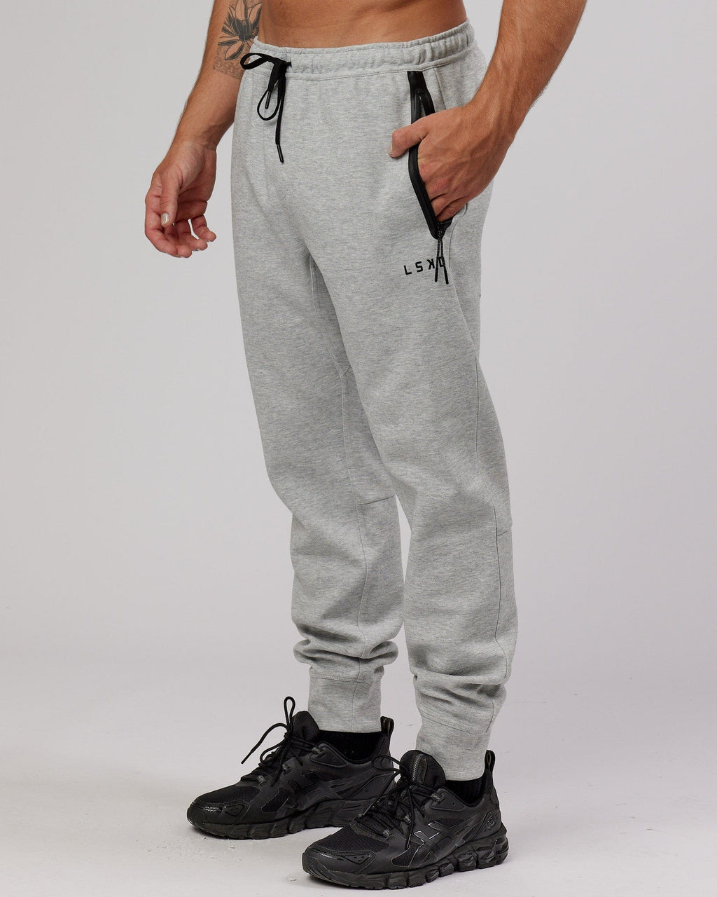 Model wearing Athlete ForgedFleece Zip Trackpant - Lt Grey Marl
