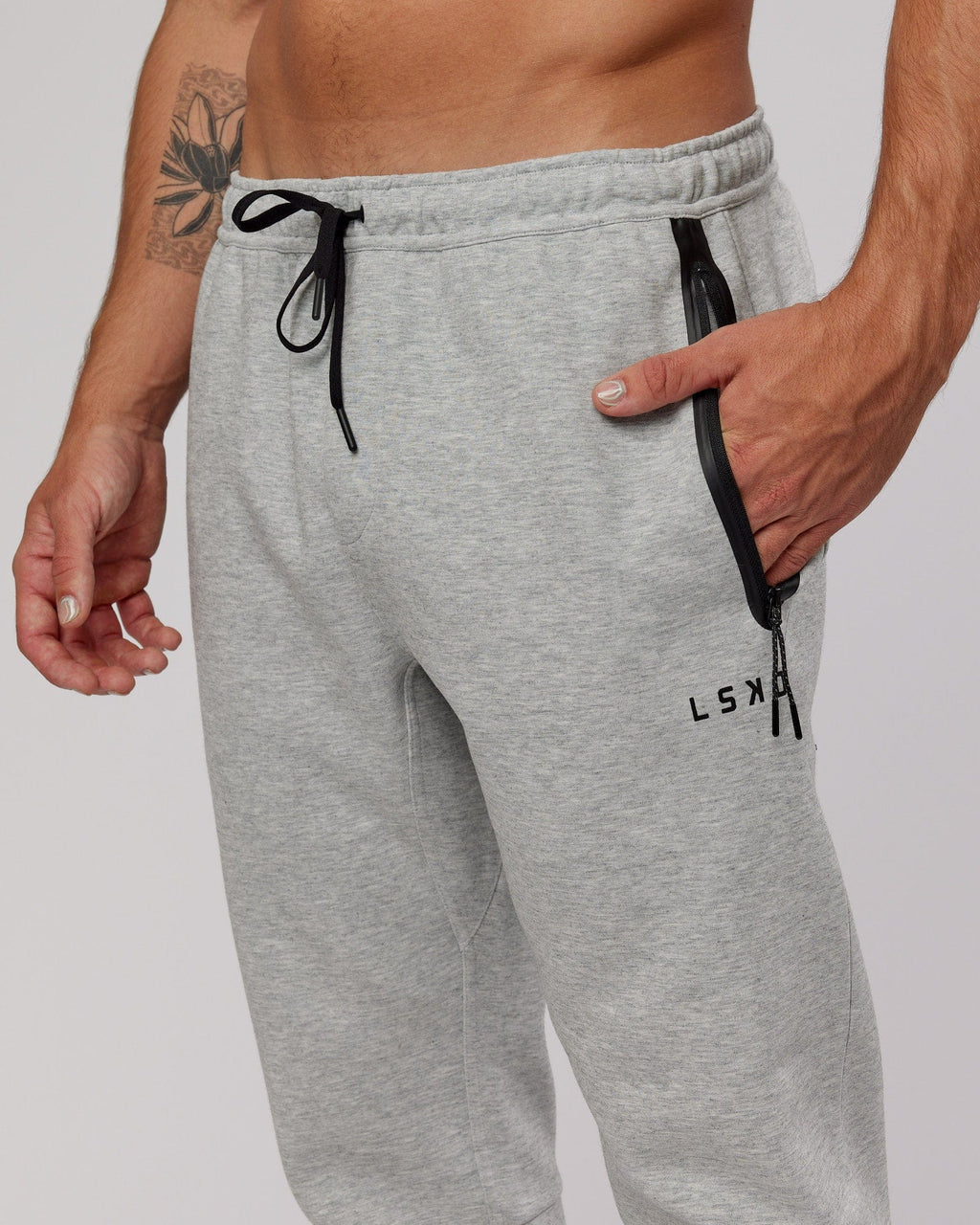 Model wearing Athlete ForgedFleece Zip Trackpant - Lt Grey Marl