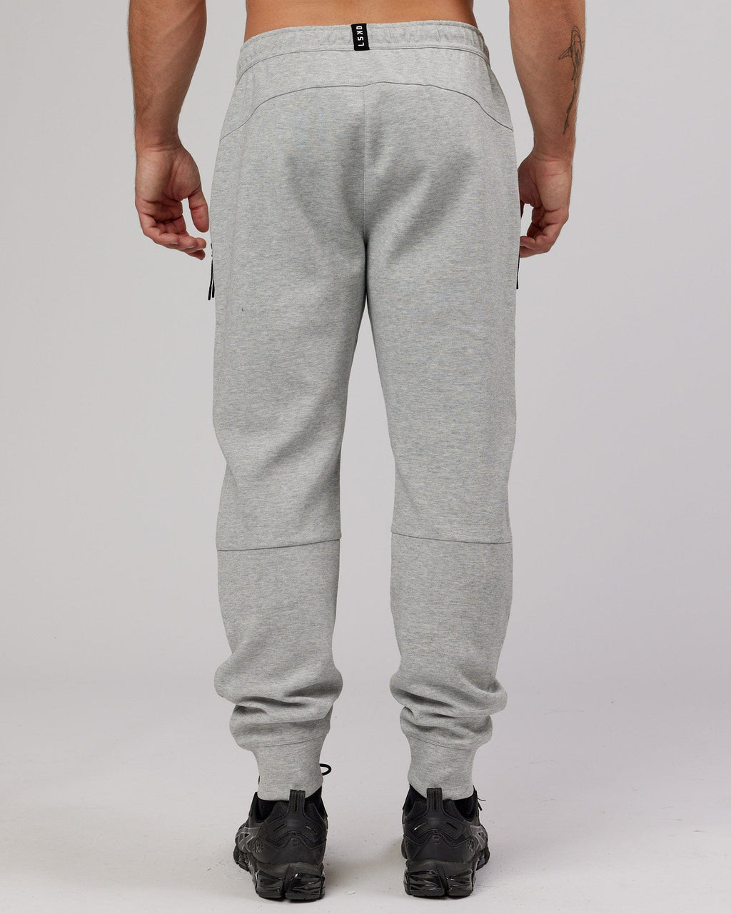 Model wearing Athlete ForgedFleece Zip Trackpant - Lt Grey Marl