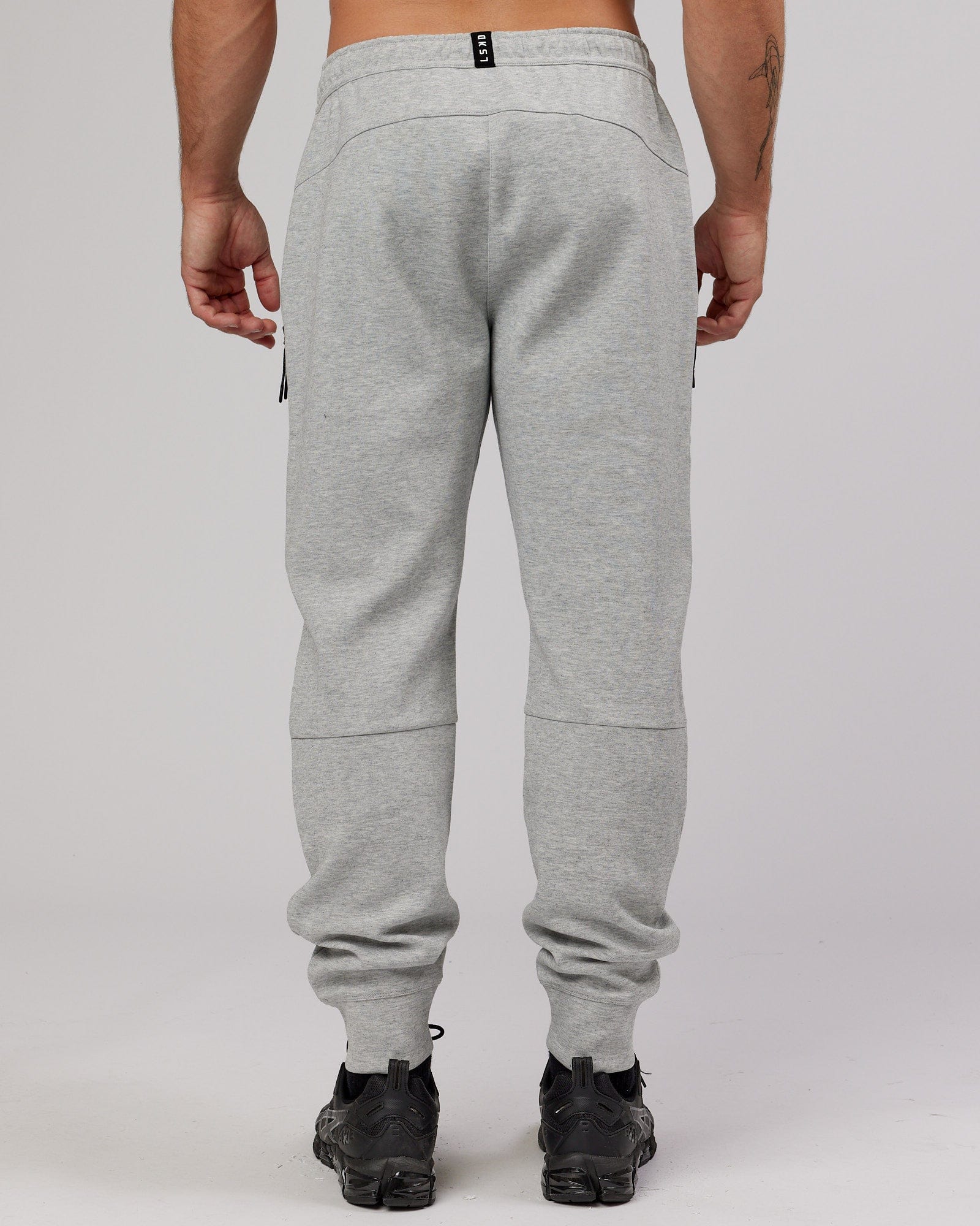 Model wearing Athlete ForgedFleece Zip Trackpant - Lt Grey Marl