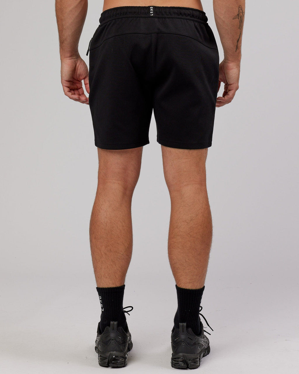 Model wearing Athlete ForgedFleece Track Short - Black