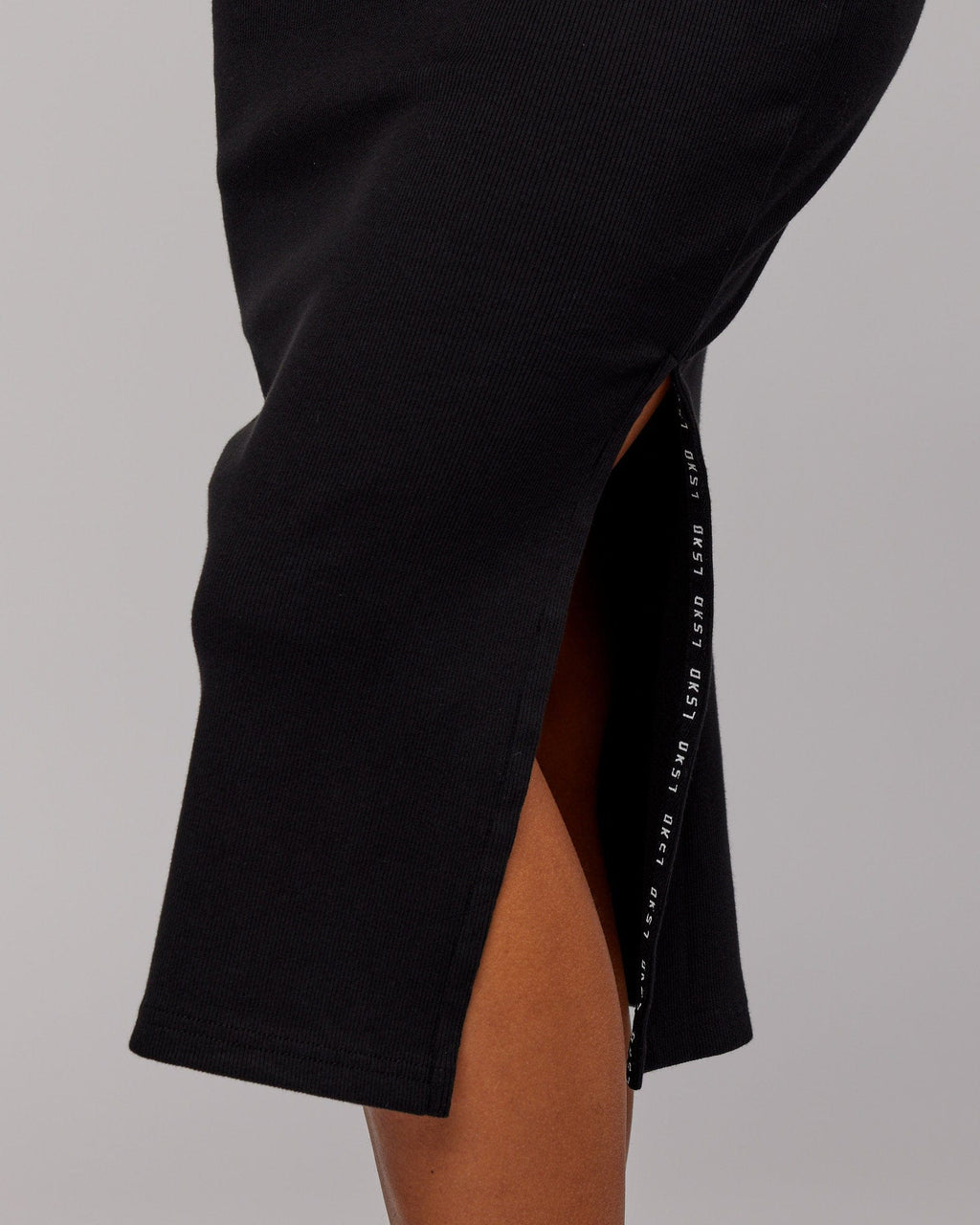 Model wearing Ava Ribbed Tank Dress - Black