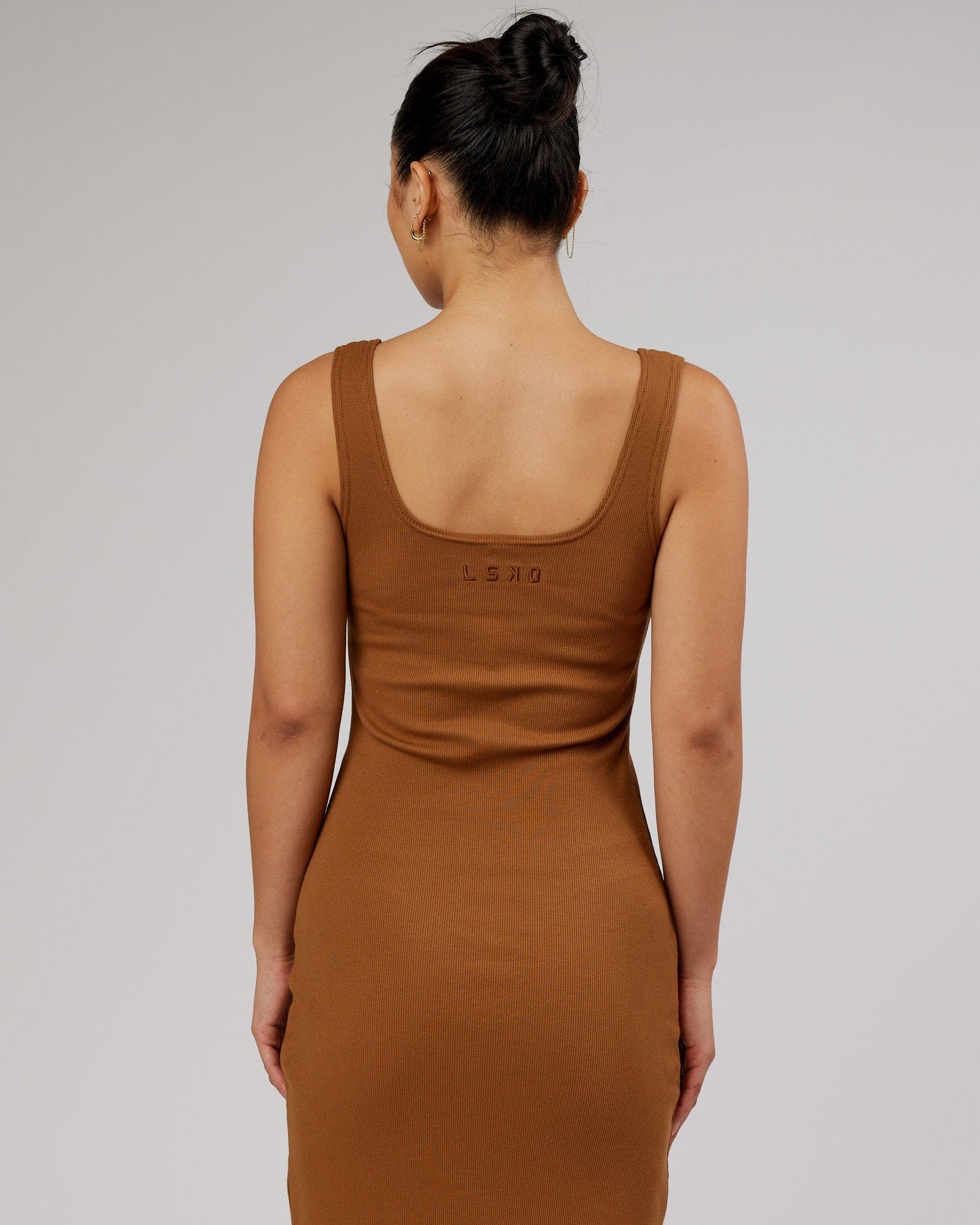 Model wearing Ava Ribbed Tank Dress - Camel