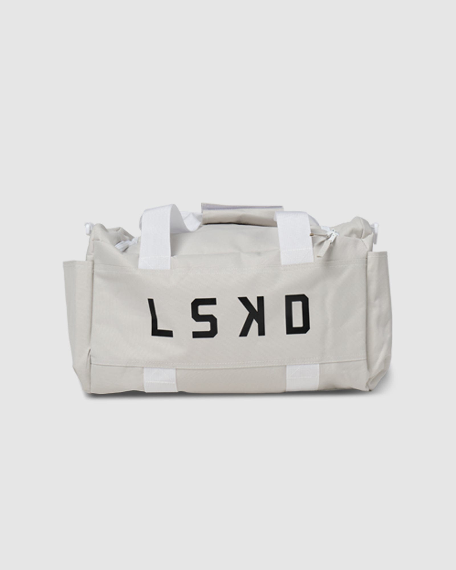 Model wearing Essential Duffle Bag Gift - Beige