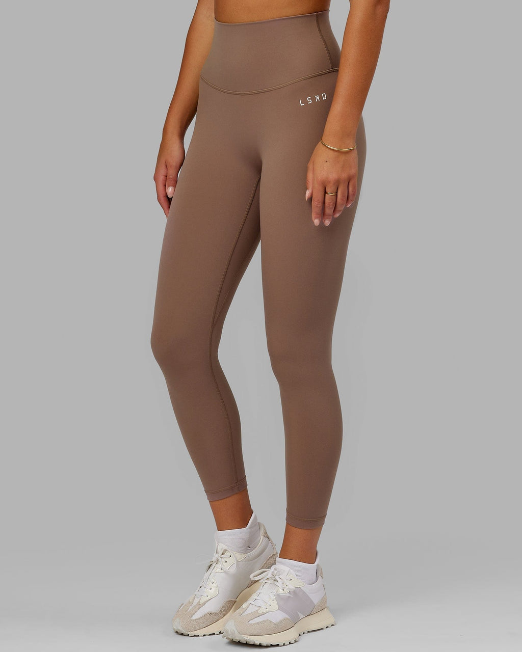 Model wearing Base 2.0 7/8 Length Tight - Deep Taupe