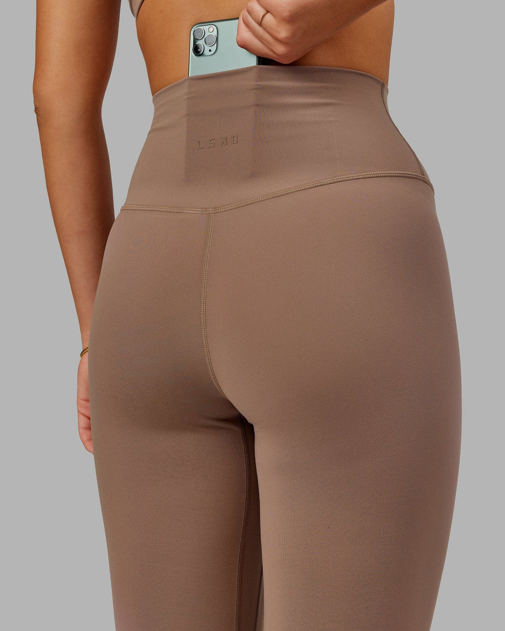 Model wearing Base 2.0 7/8 Length Tight - Deep Taupe