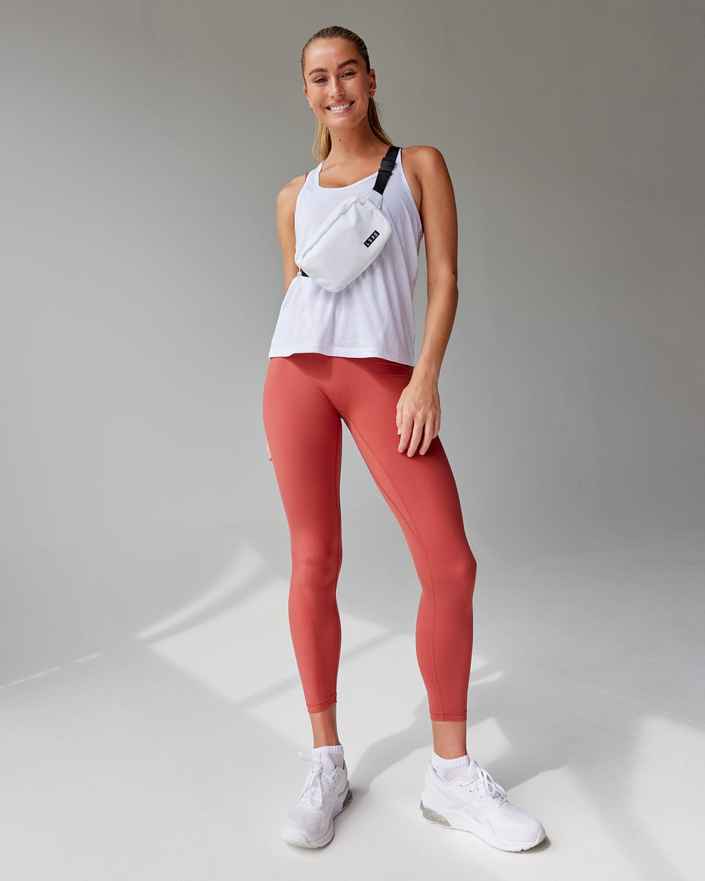 Model wearing Base 2.0 7/8 Length Tight - Paprika