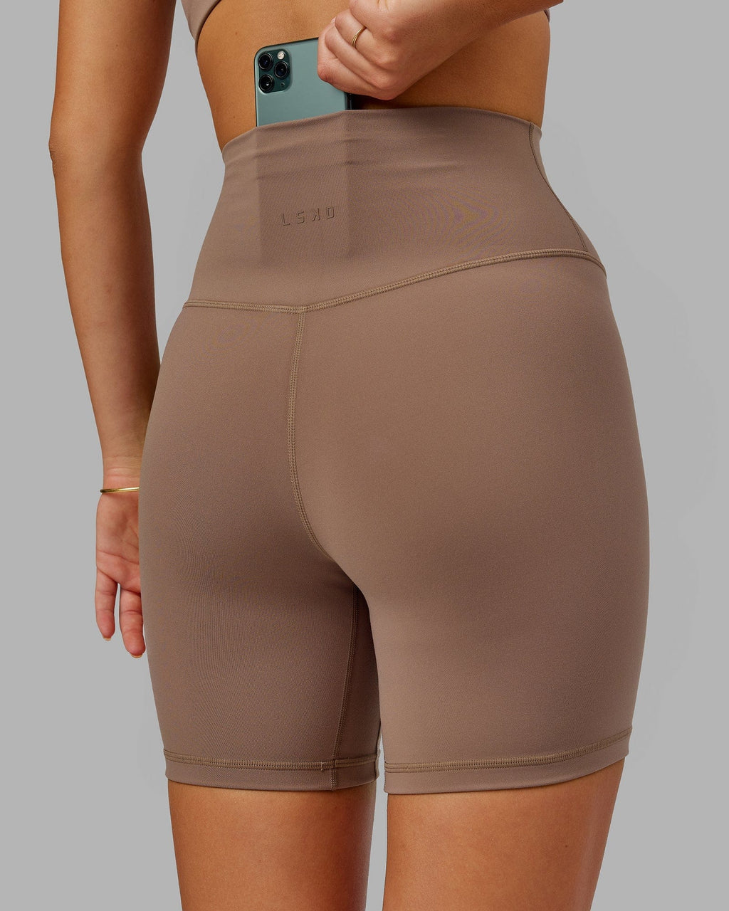 Model wearing Base 2.0 Mid Short Tight - Deep Taupe