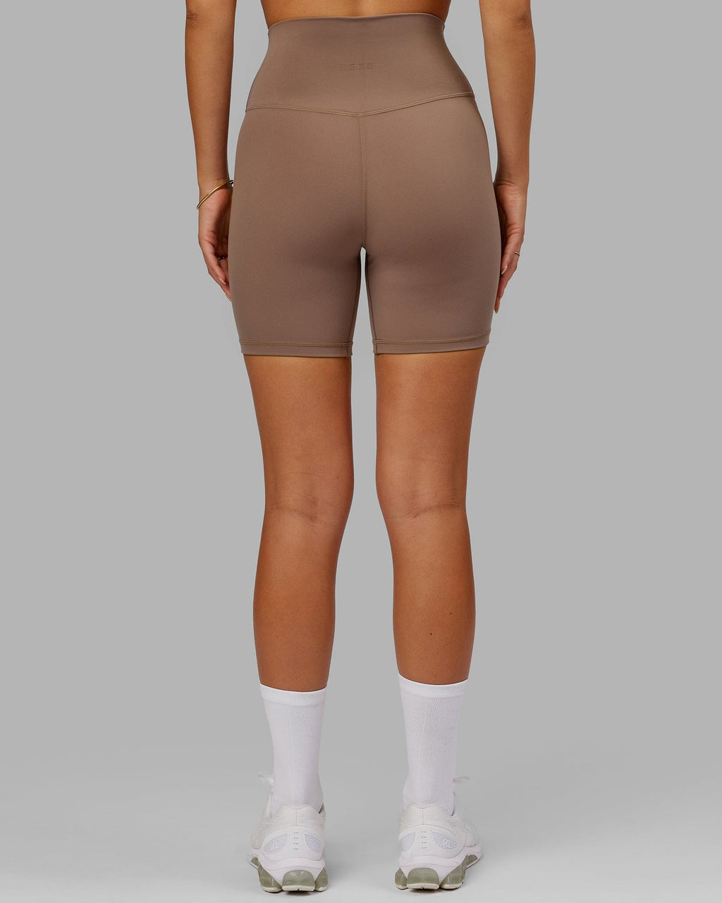 Model wearing Base 2.0 Mid Short Tight - Deep Taupe