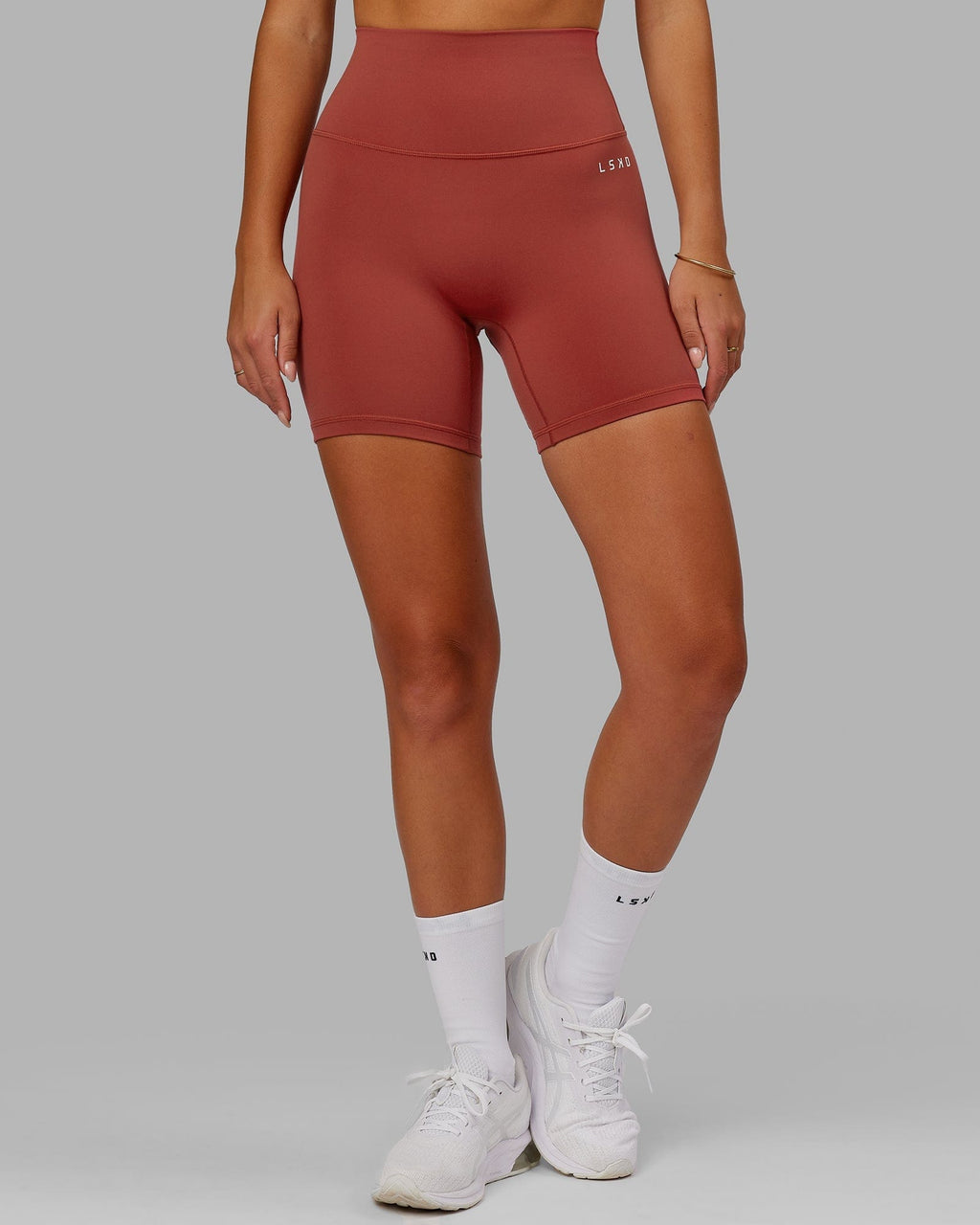 Model wearing Base 2.0 Mid Short Tight - Paprika