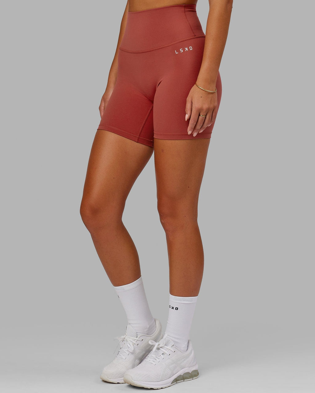 Model wearing Base 2.0 Mid Short Tight - Paprika