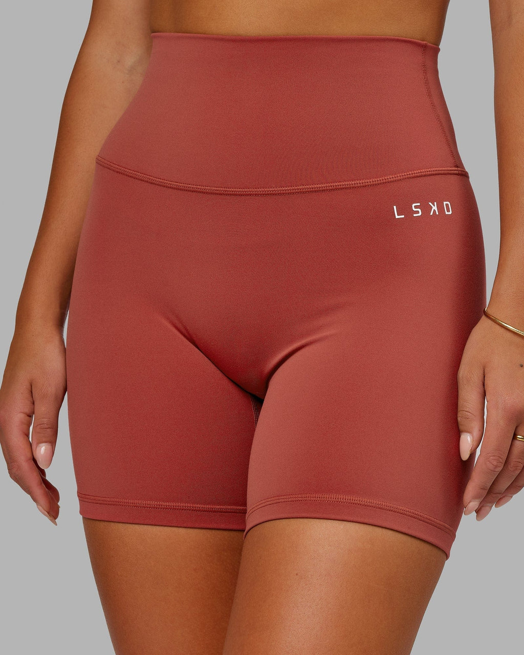 Model wearing Base 2.0 Mid Short Tight - Paprika
