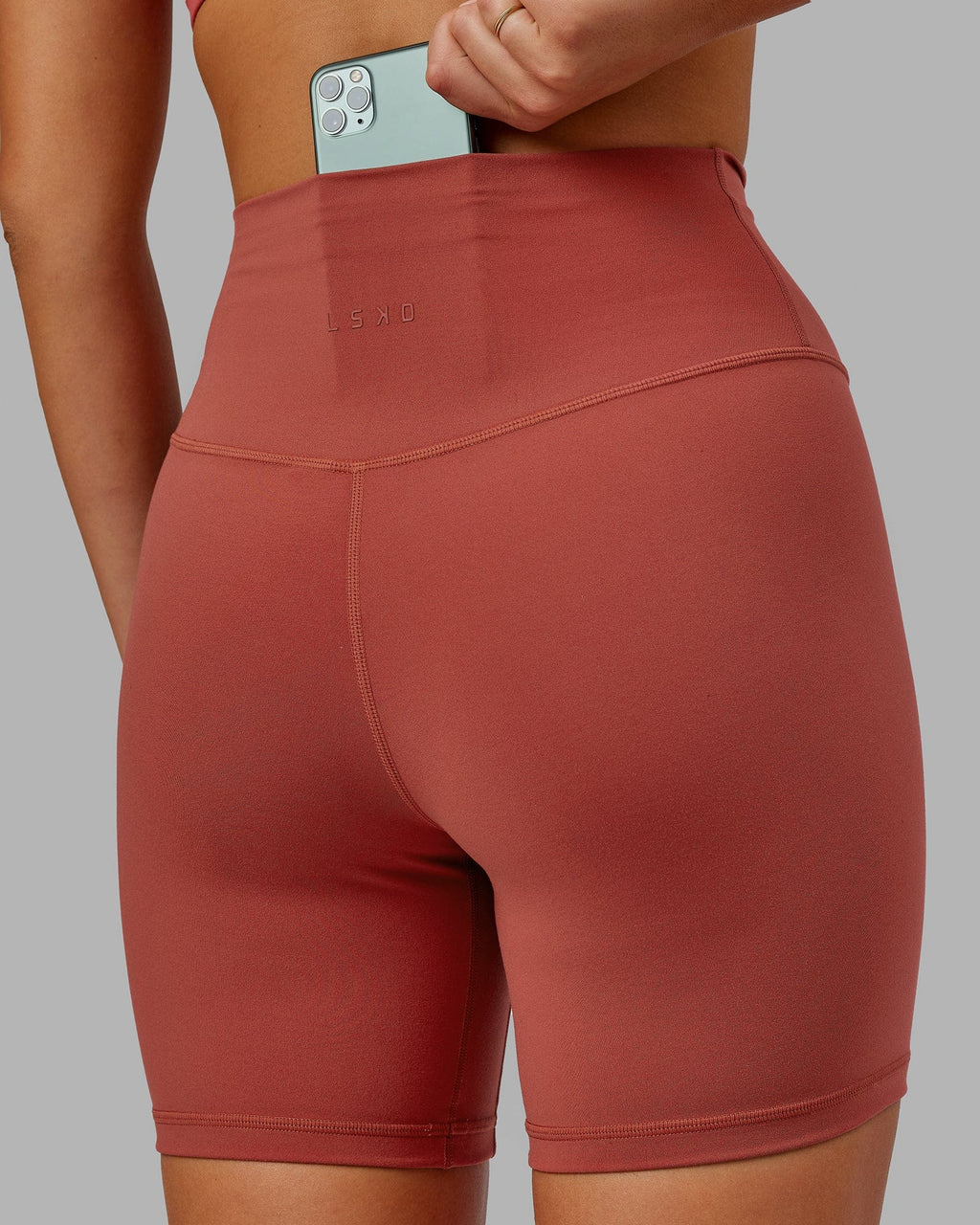 Model wearing Base 2.0 Mid Short Tight - Paprika