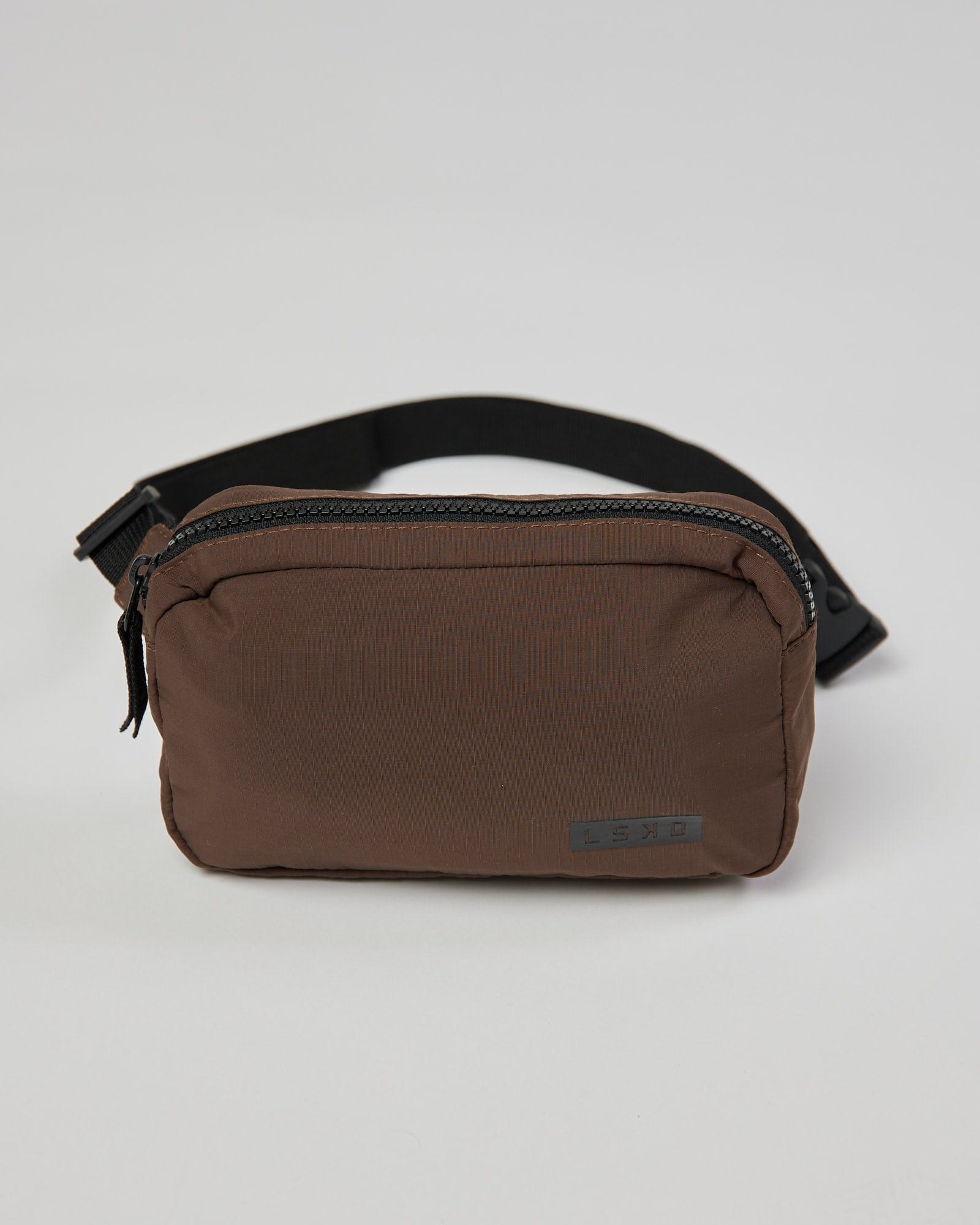 Model wearing Base Cross Body Bag - Walnut