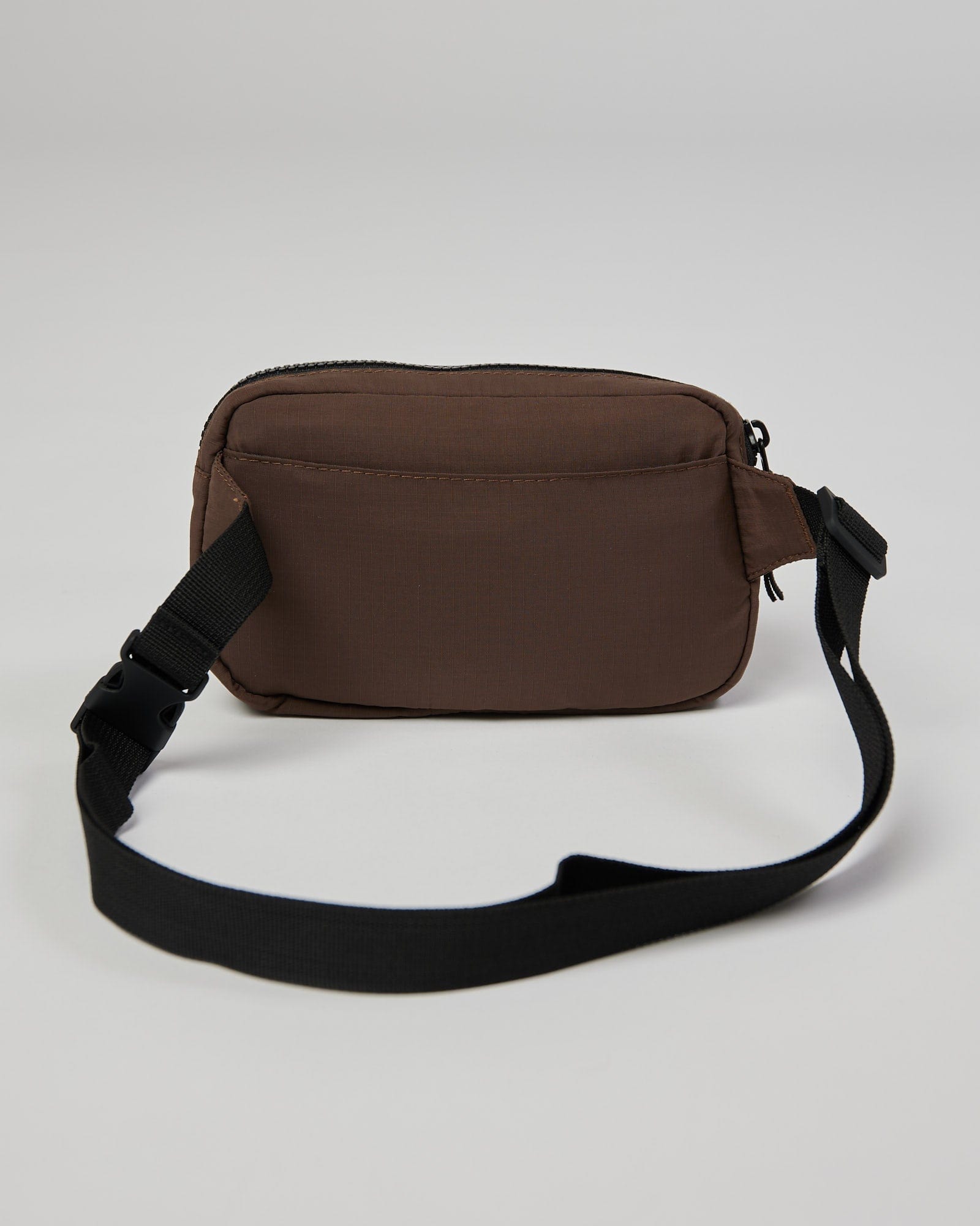 Model wearing Base Cross Body Bag - Walnut