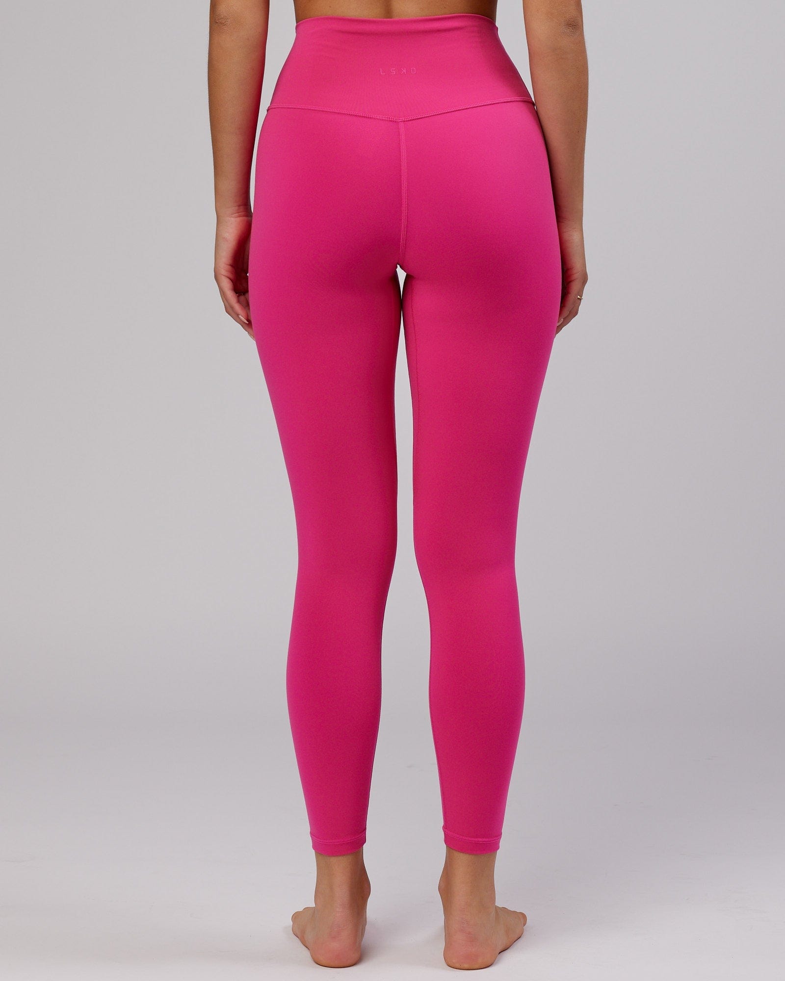 Model wearing Base Full Length Tight - Magenta