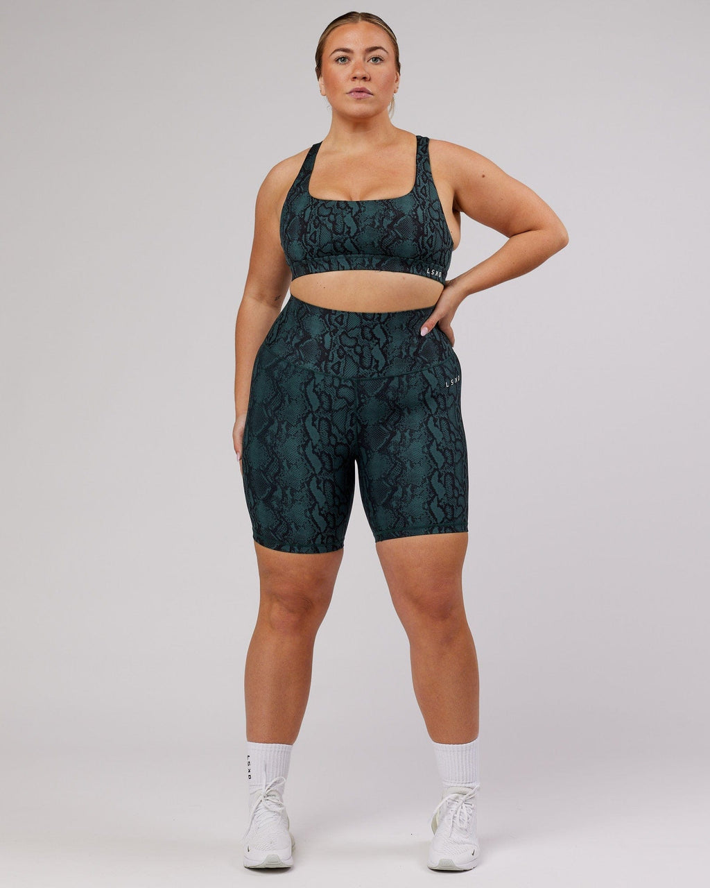 Model wearing Base Mid Short Tight - Forest Snakeskin