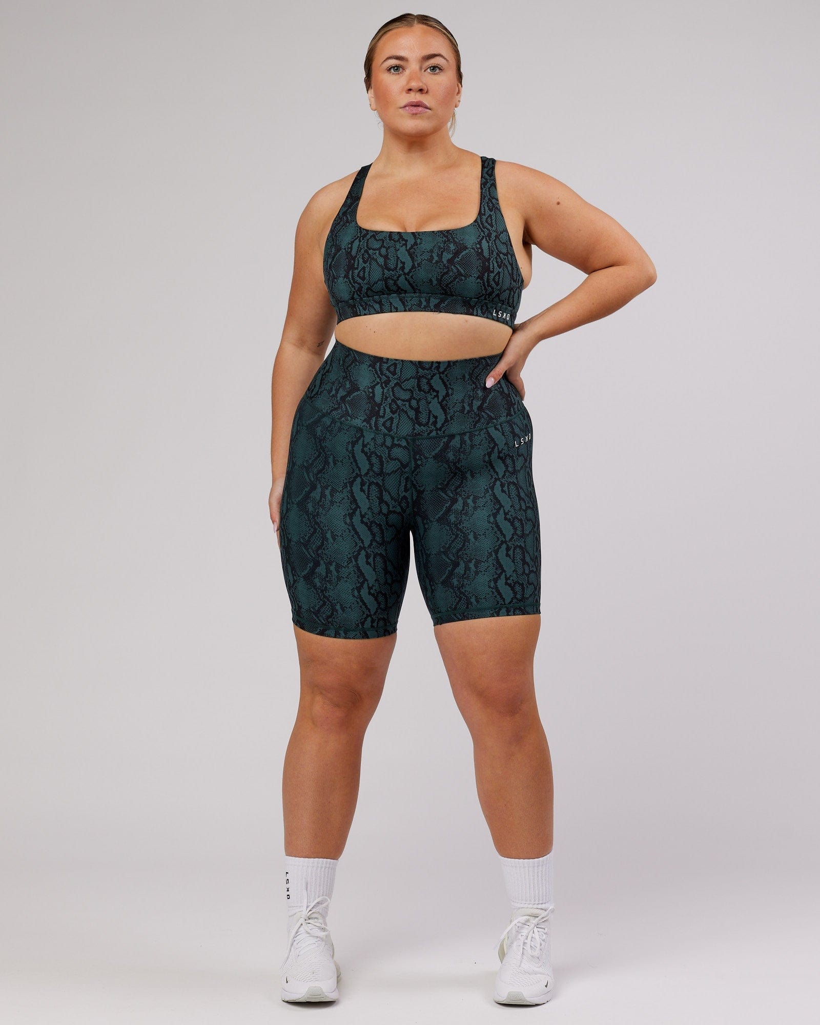 Model wearing Base Mid Short Tight - Forest Snakeskin