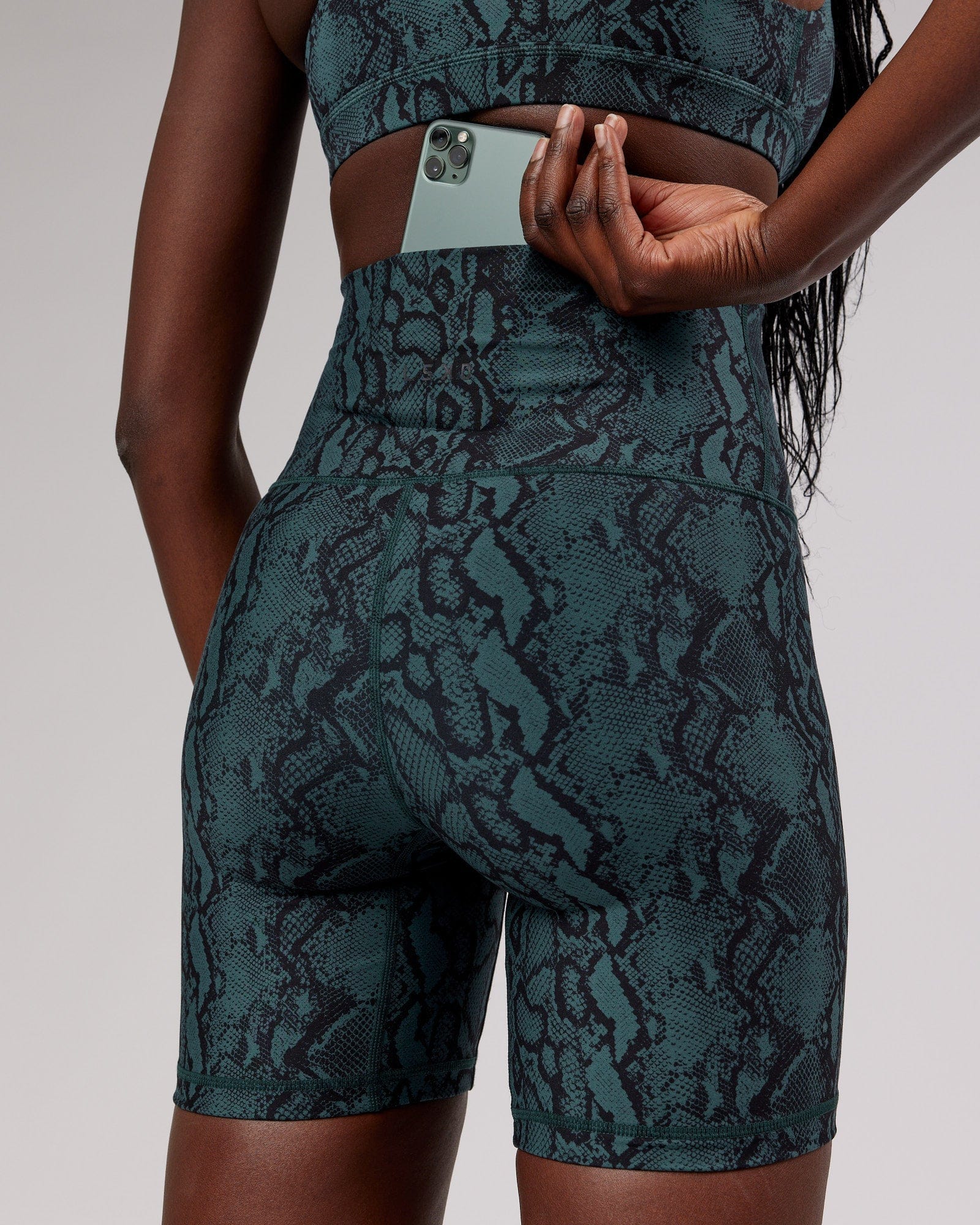 Model wearing Base Mid Short Tight - Forest Snakeskin