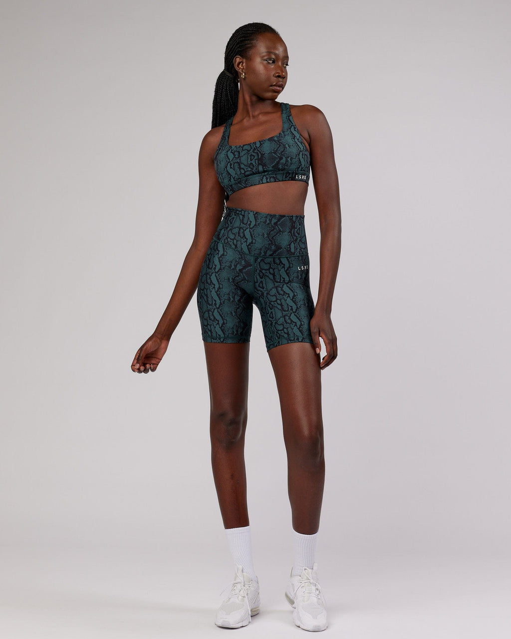 Model wearing Base Mid Short Tight - Forest Snakeskin