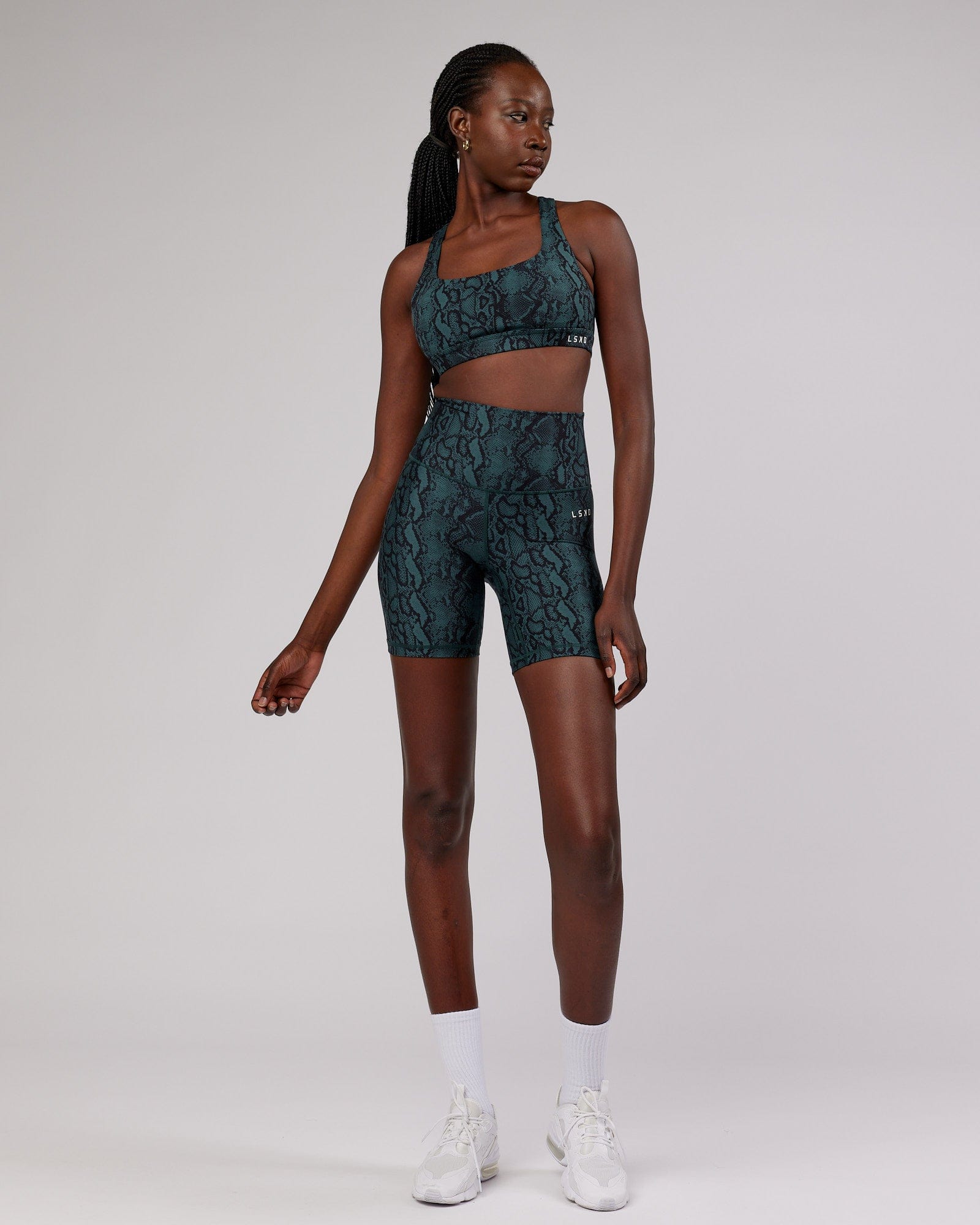 Model wearing Base Mid Short Tight - Forest Snakeskin