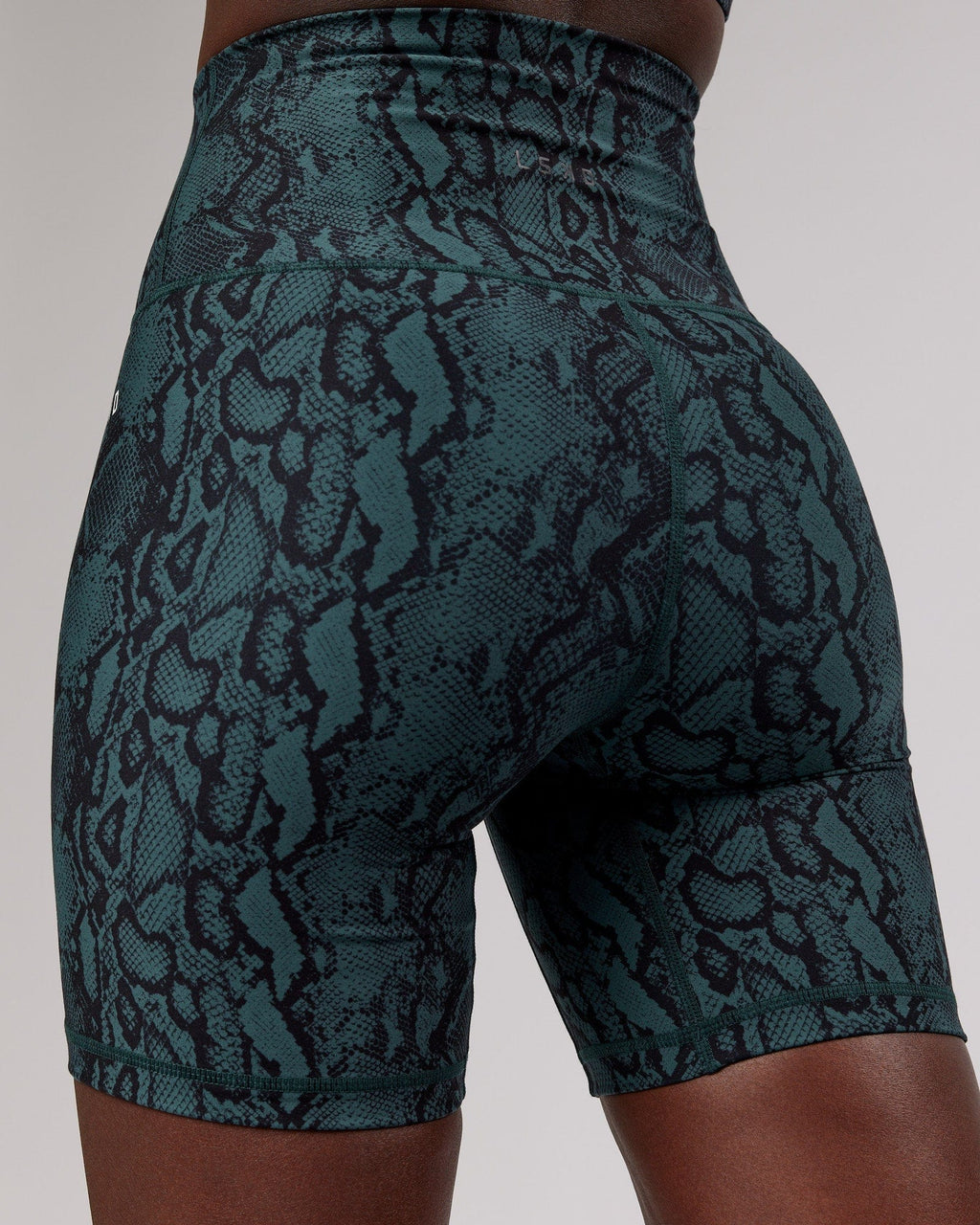 Model wearing Base Mid Short Tight - Forest Snakeskin