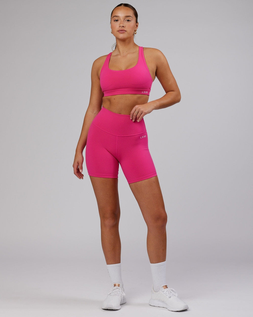 Model wearing Base Mid Short Tight - Magenta