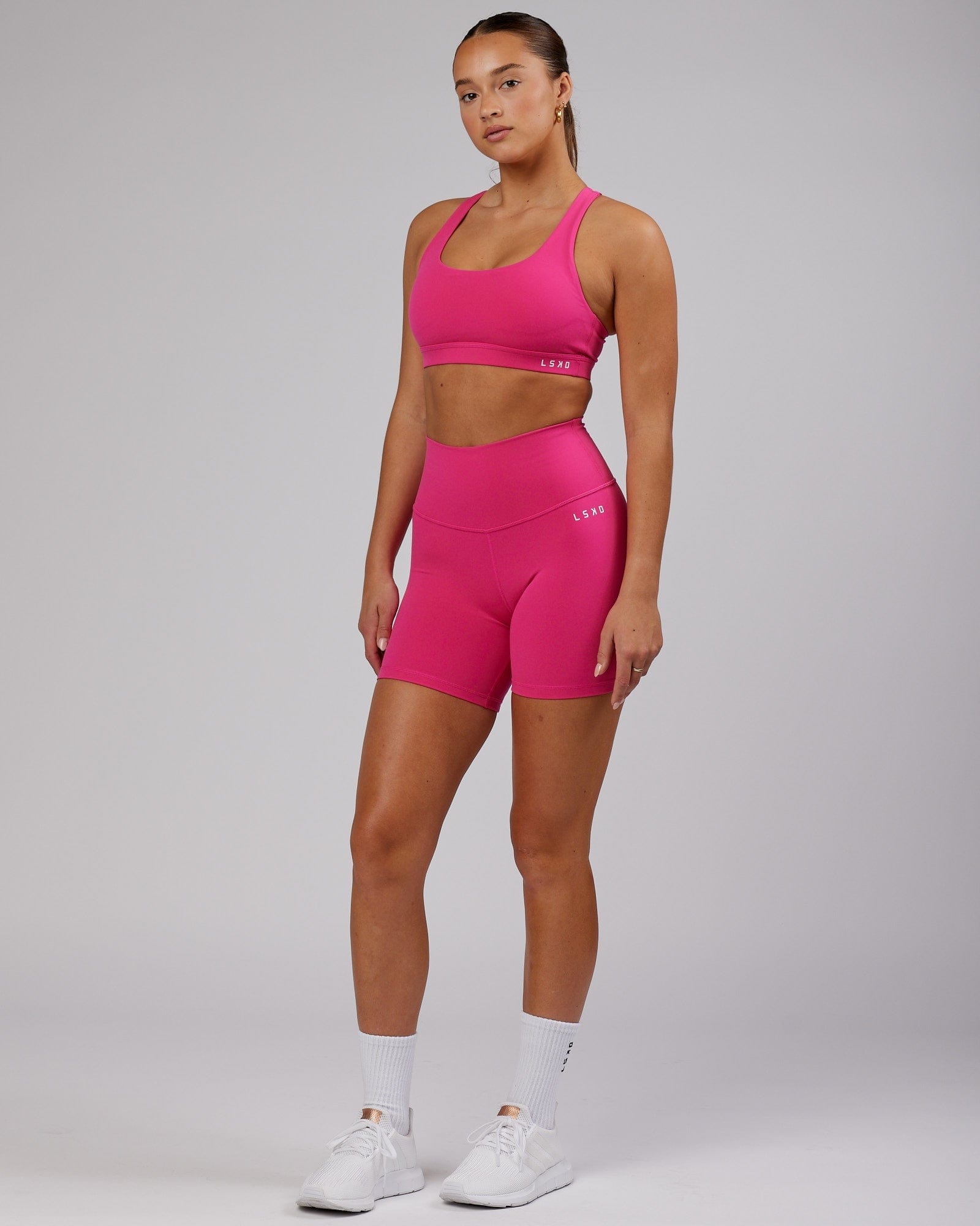 Model wearing Base Mid Short Tight - Magenta