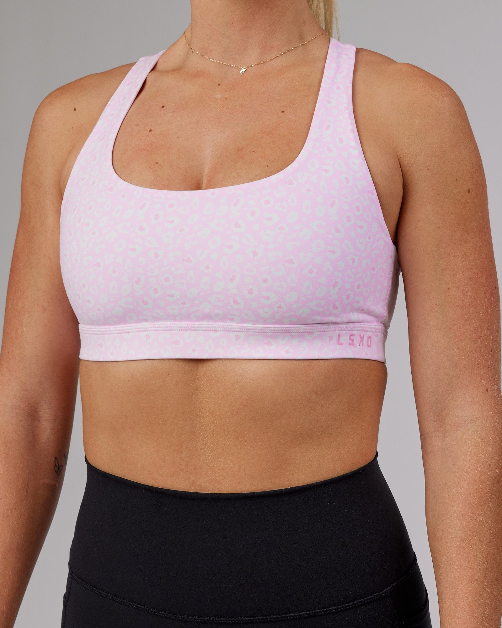 Model wearing Base Sports Bra - Blush Leopard