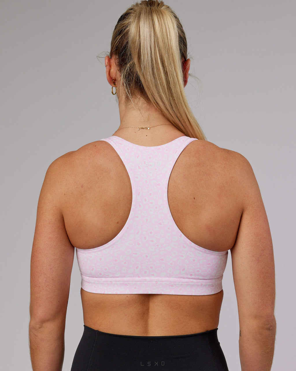 Model wearing Base Sports Bra - Blush Leopard