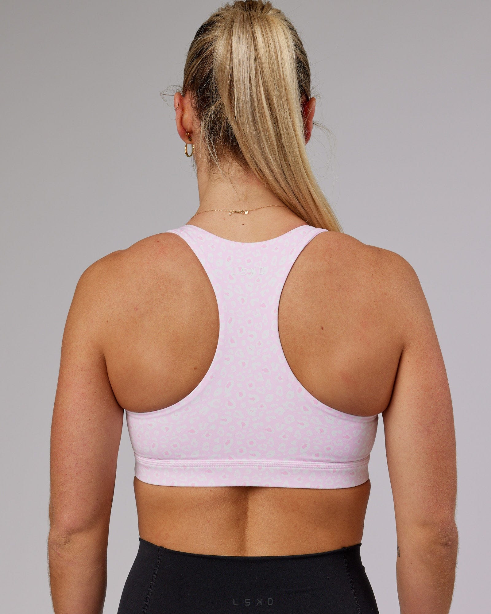 Model wearing Base Sports Bra - Blush Leopard