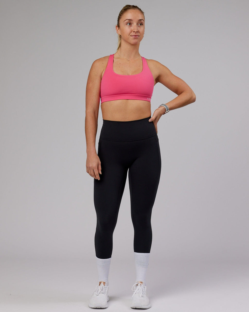Model wearing Base Sports Bra - Flamingo