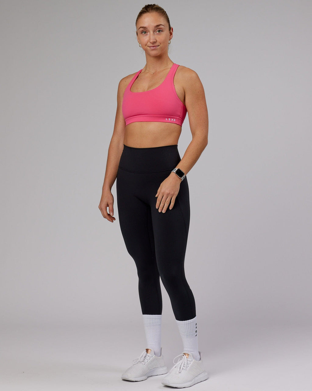 Model wearing Base Sports Bra - Flamingo